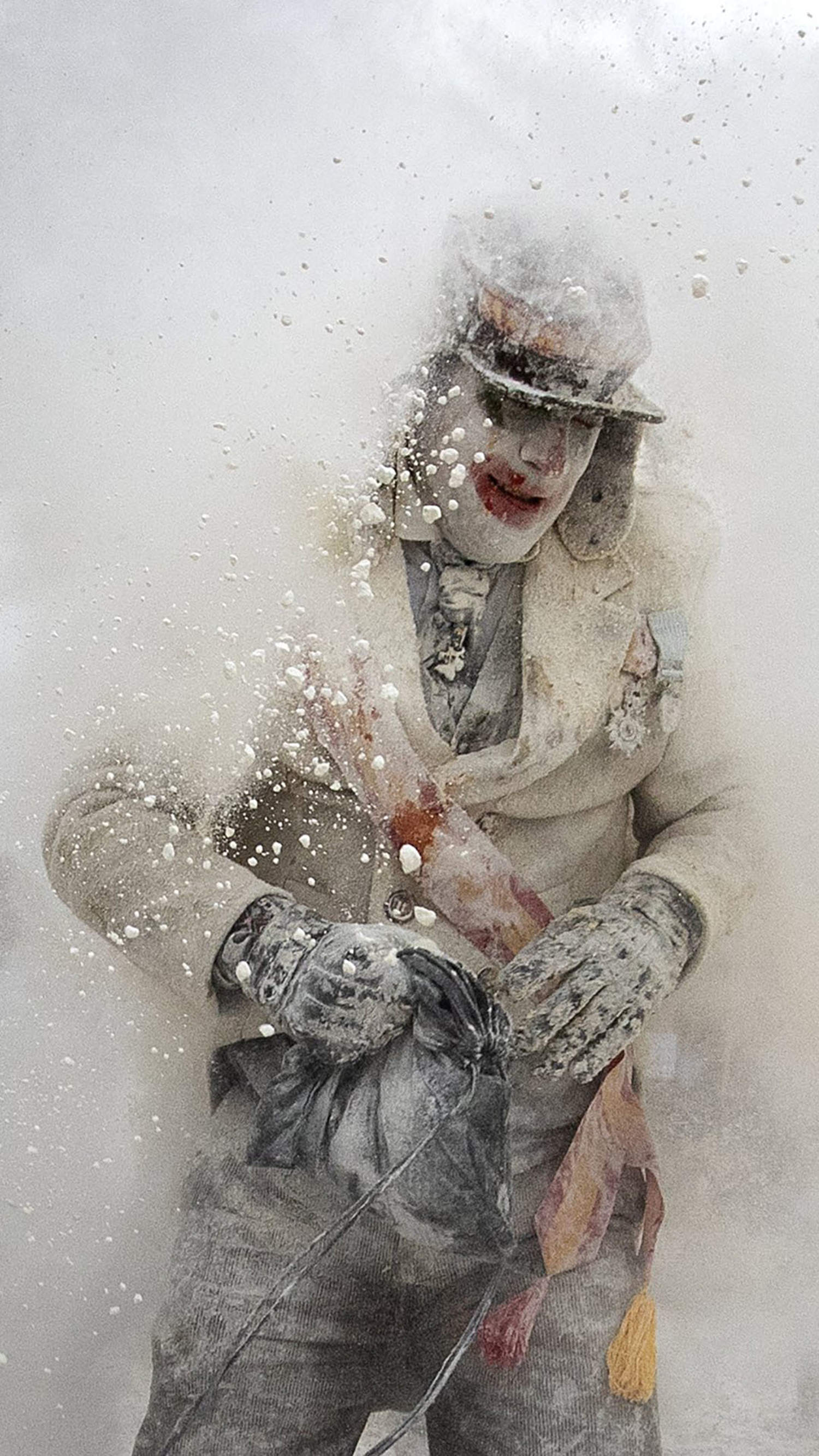 Revelers fight with flour, eggs and firecrackers in Spain