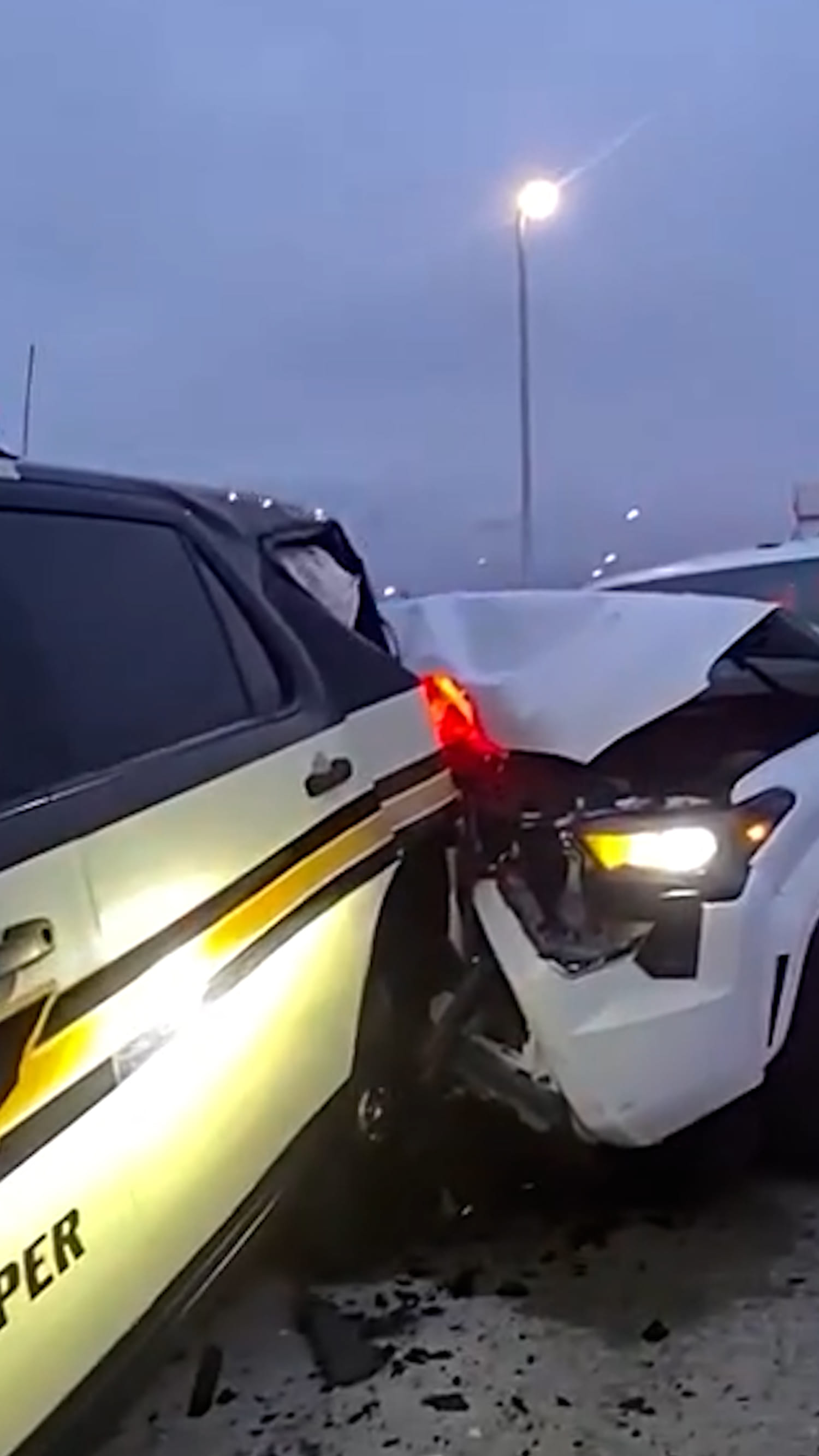 Trooper nearly pinned after his car is hit on highway