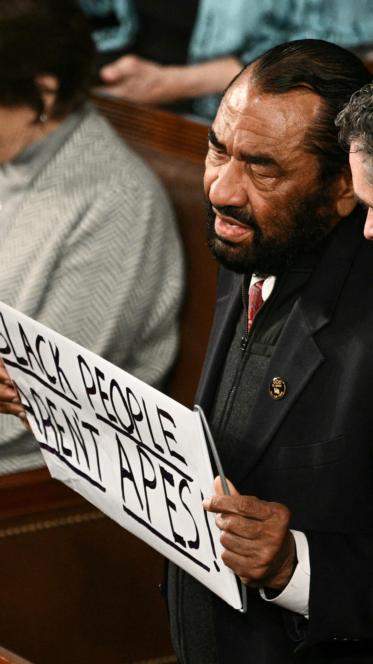 Rep. Al Green holds ‘Black people aren’t apes’ sign