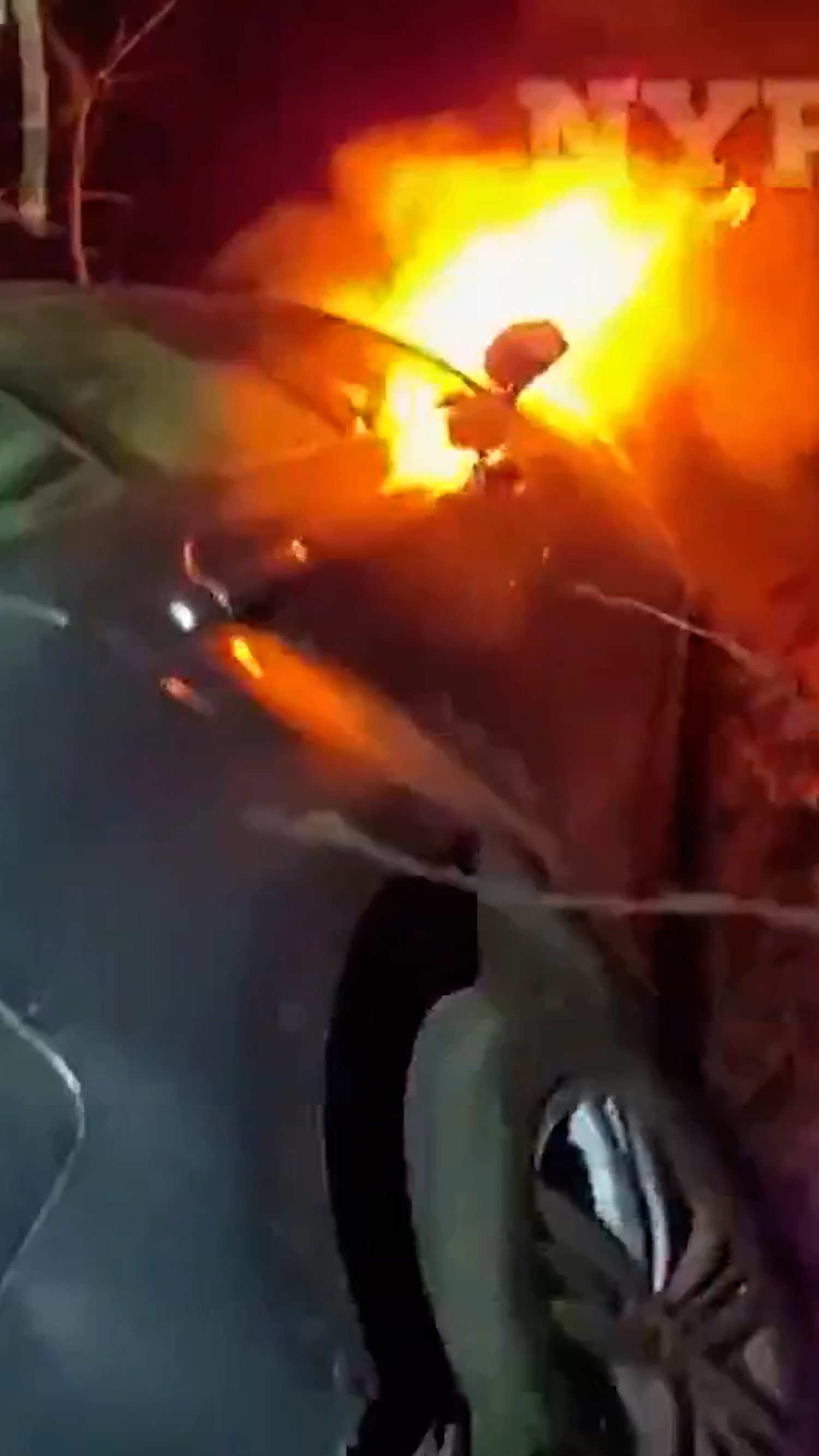 Three people rescued from a burning car in New York