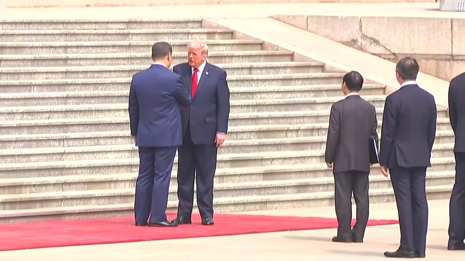 Trump shakes hands with Xi at start of historic U.S.-China summit