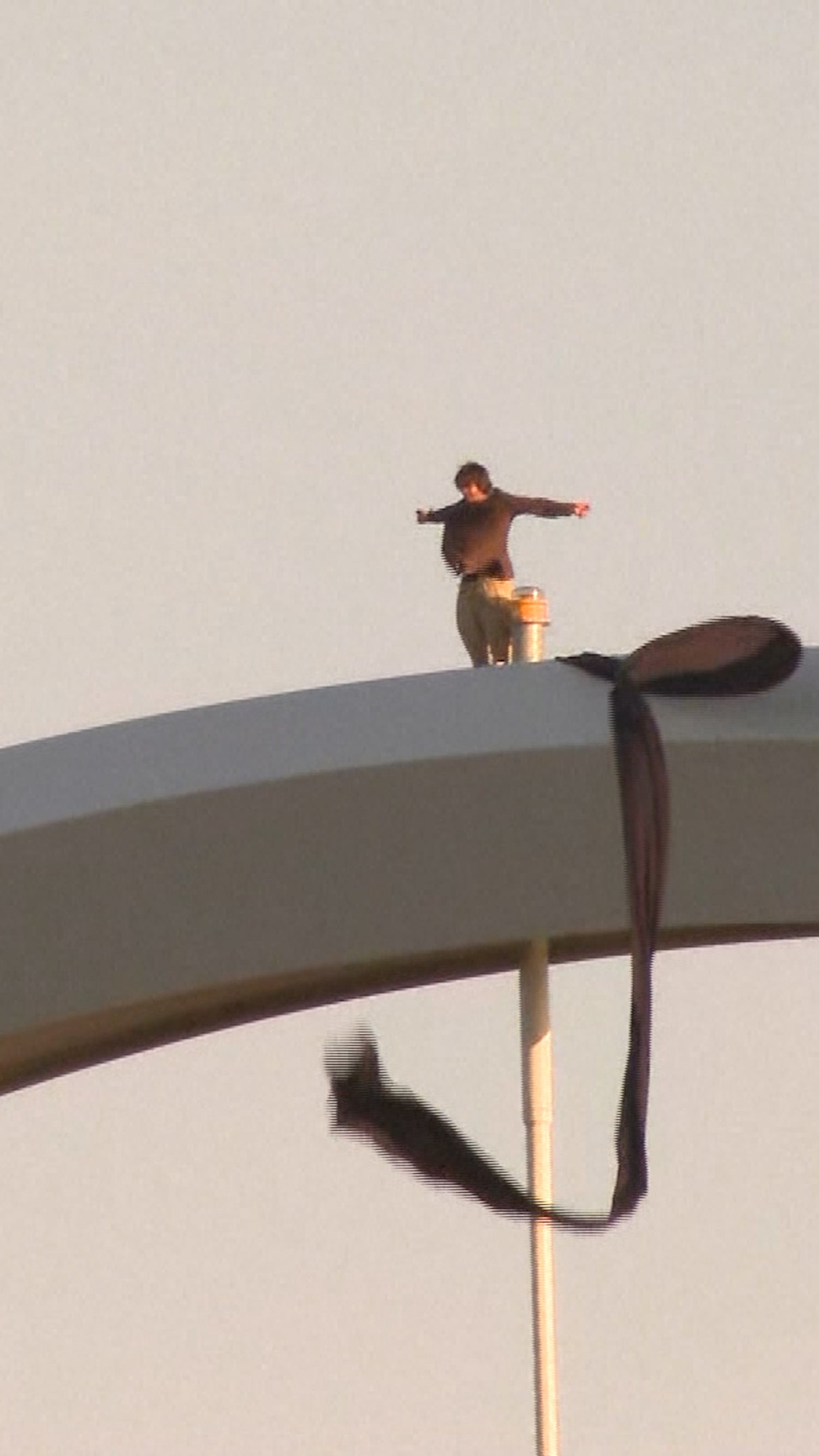 Man climbs D.C. bridge to protest Iran war