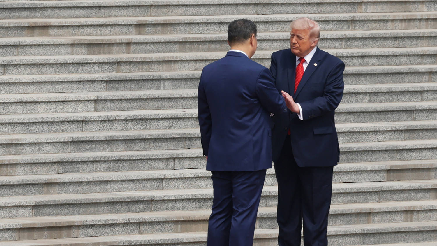 Trump shakes hands with Xi at start of historic U.S.-China summit