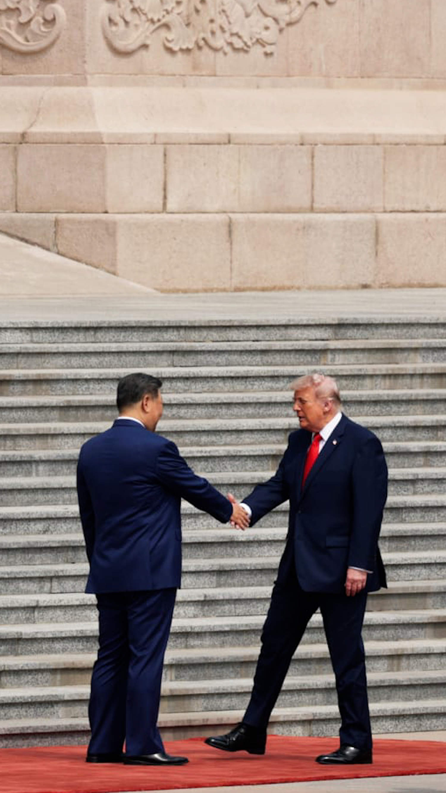 Trump and Xi shake hands ahead of bilateral talks