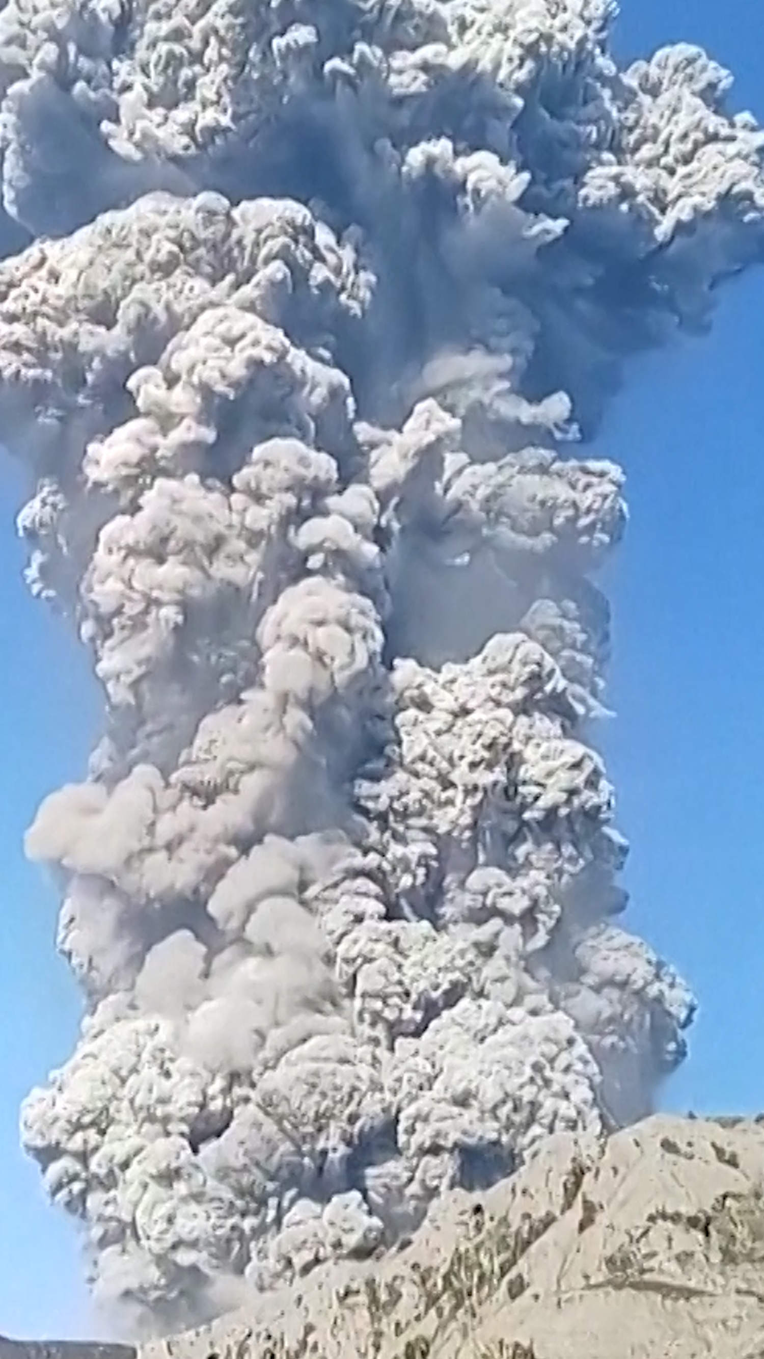 Hikers descend Mount Dukono after volcano erupts