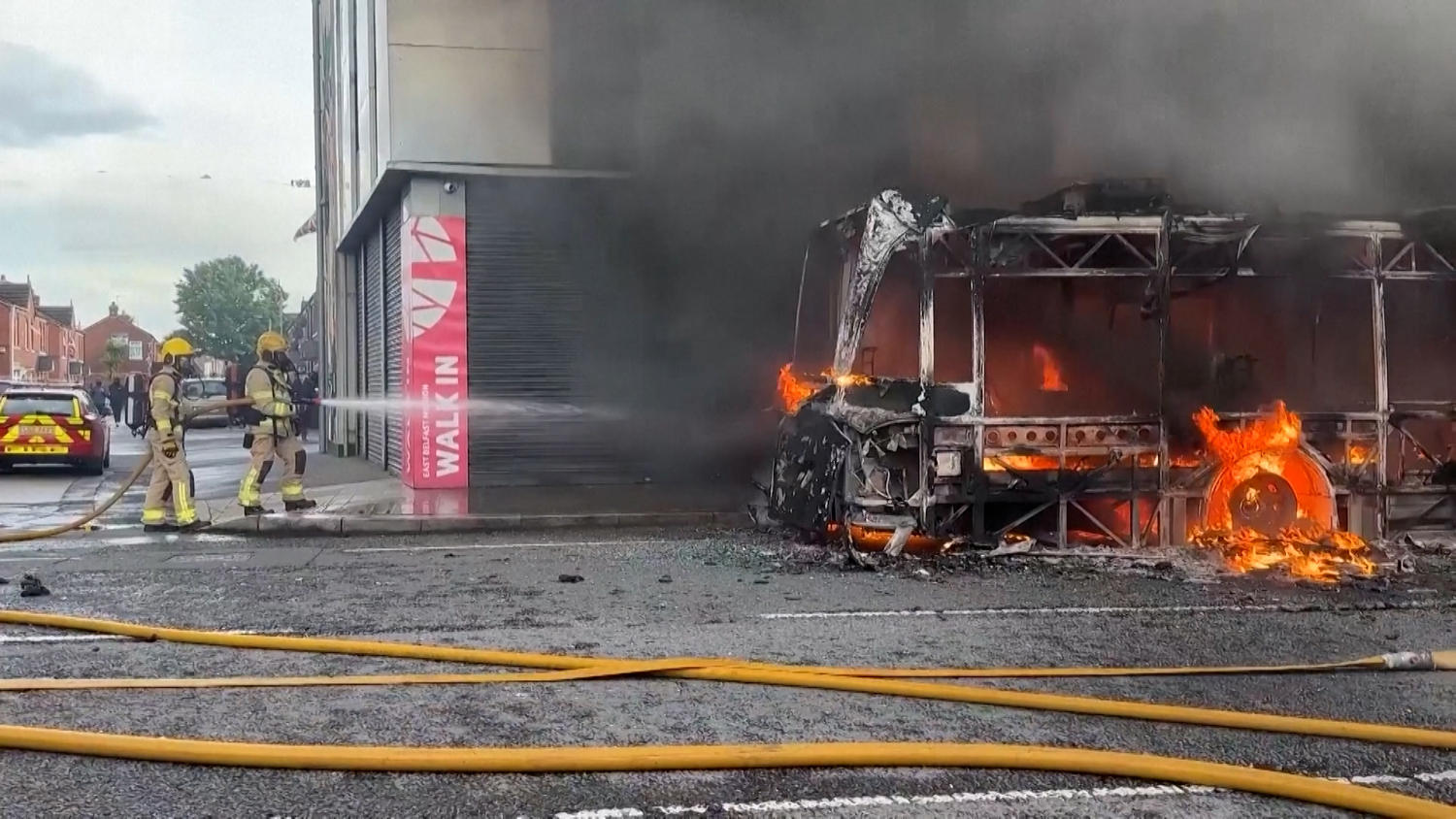 Protesters set Glider bus alight in east Belfast amid anti-immigration unrest after stabbing