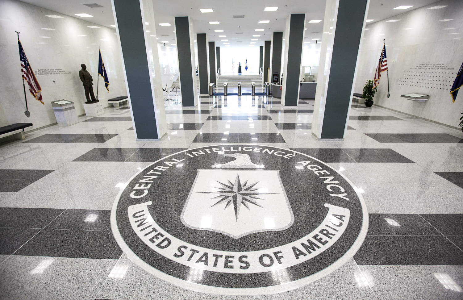 A federal judge temporarily halted the firing of 11 U.S. intelligence officers