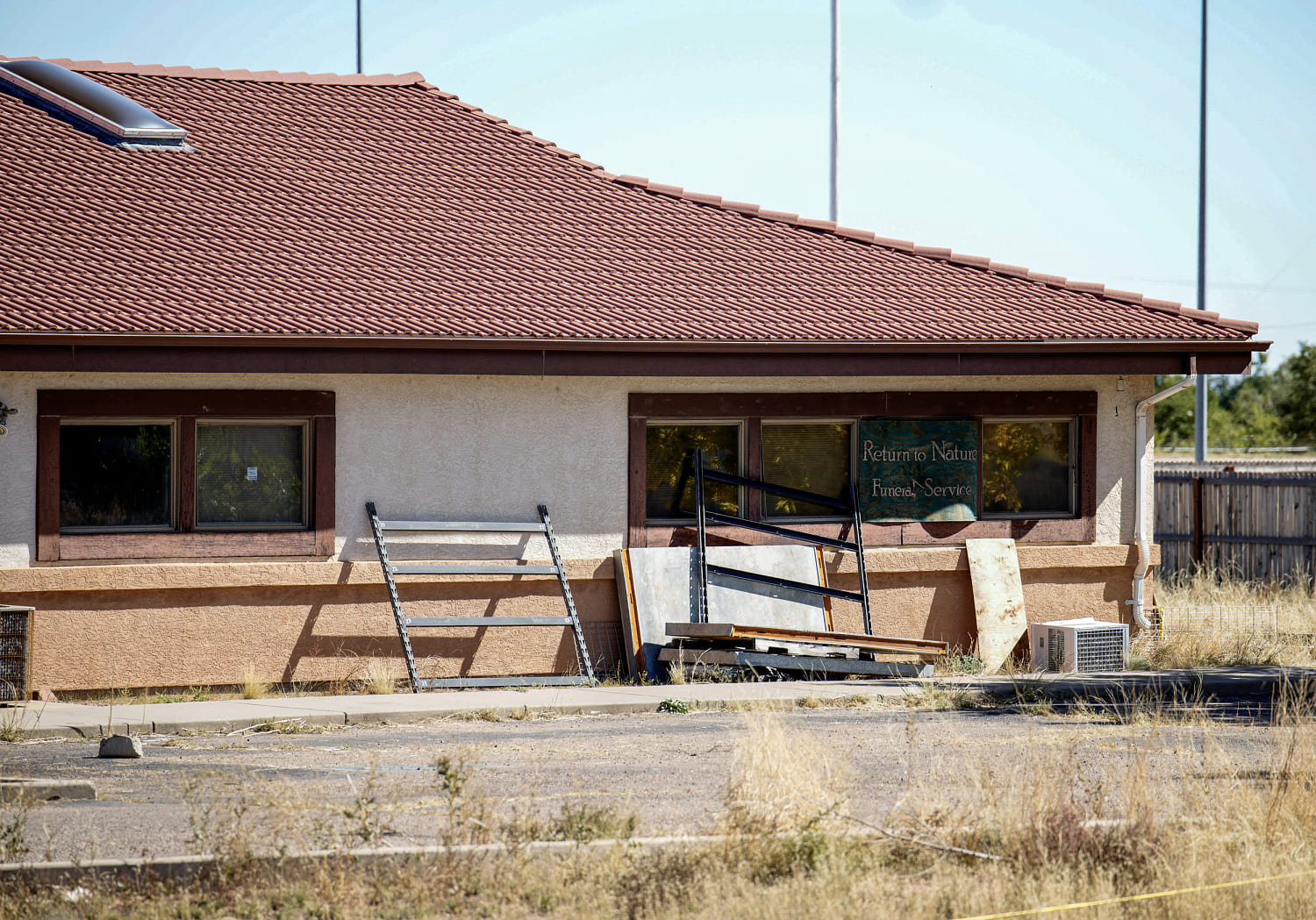 Colorado funeral home owners accused of storing 190 decaying bodies are charged with Covid fraud