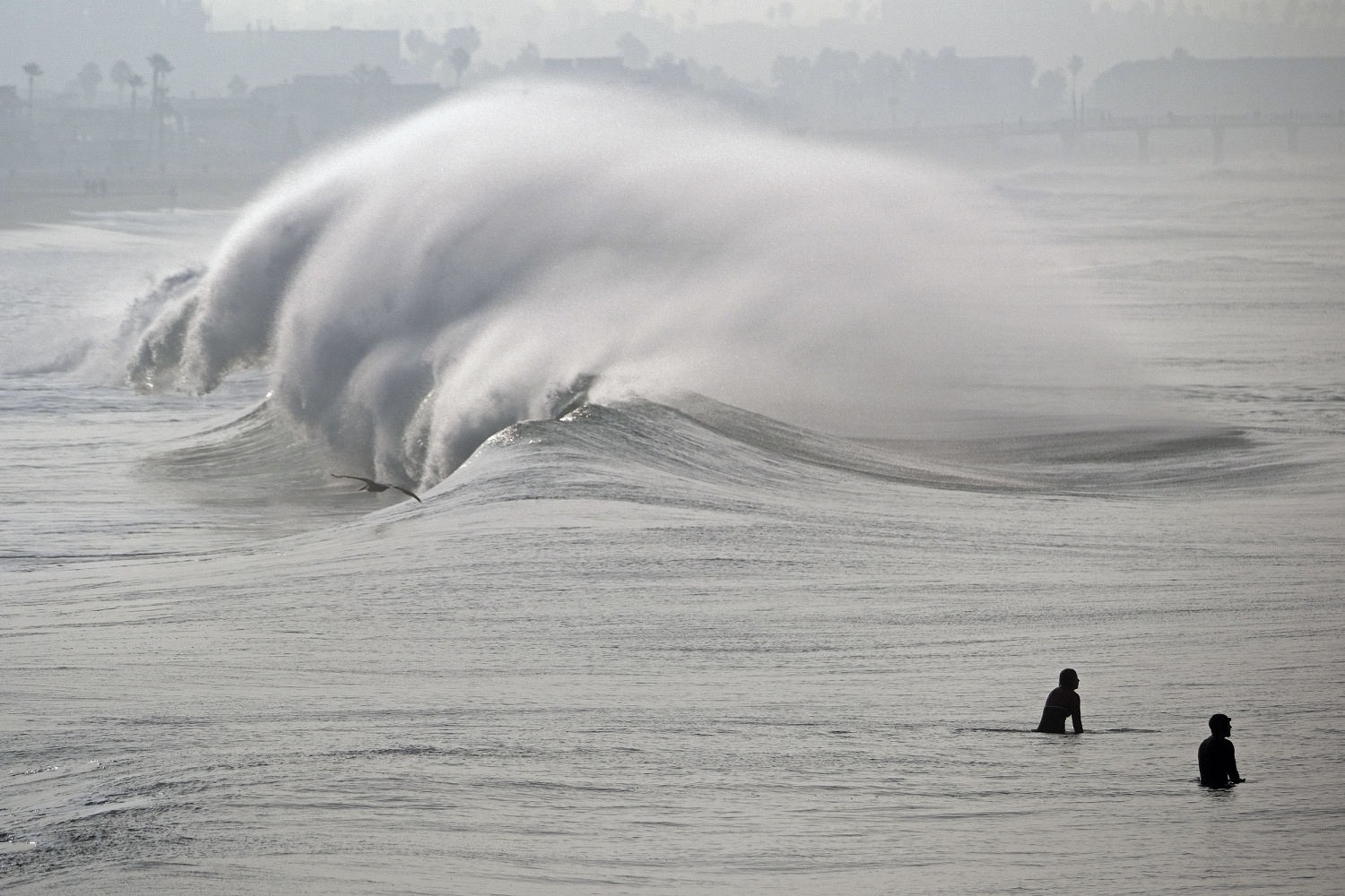 Powerful surf hits West Coast and Hawaii, flooding some low-lying areas