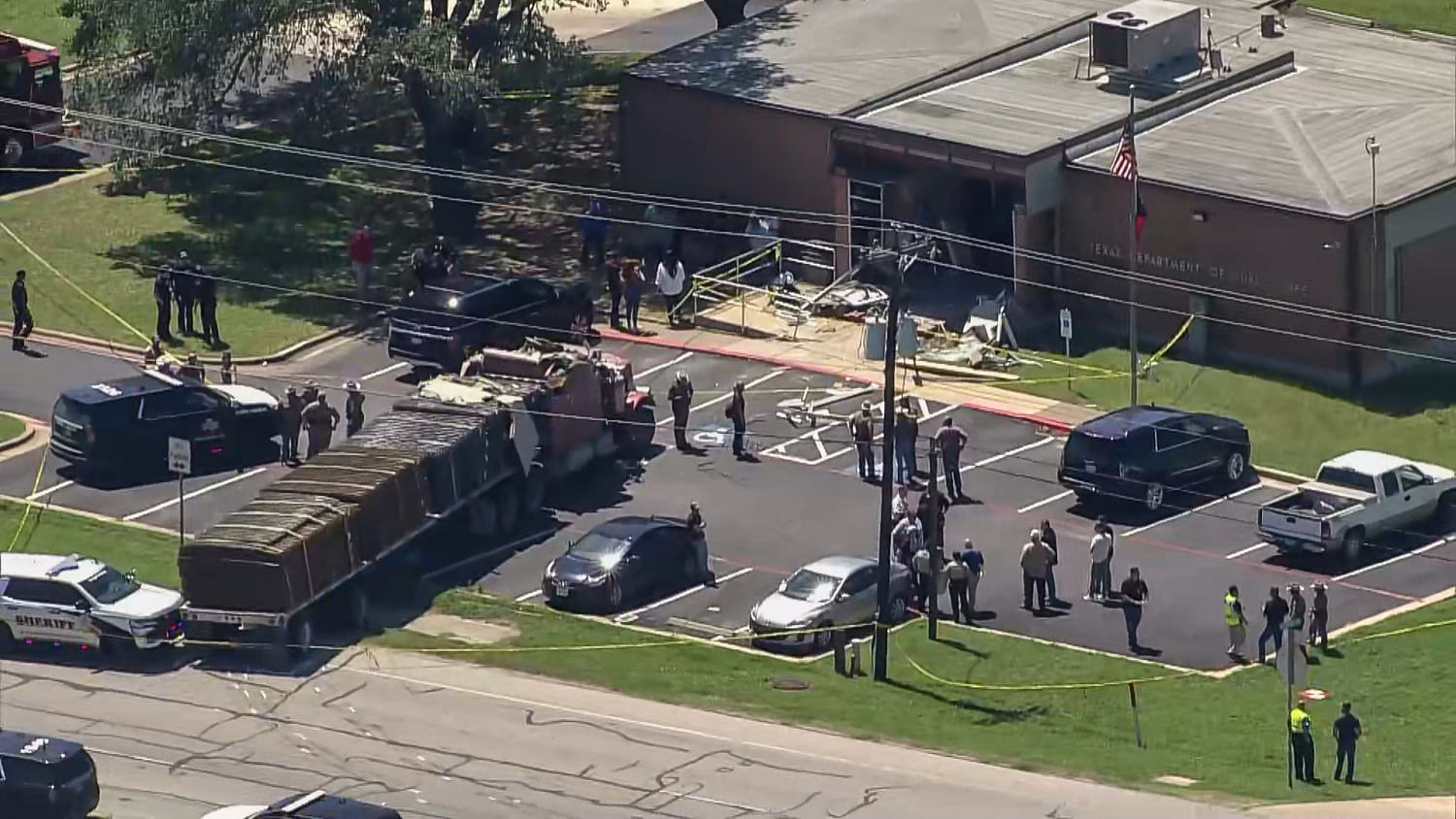 1 dead, 13 injured after stolen semi-truck is rammed into Texas DPS office