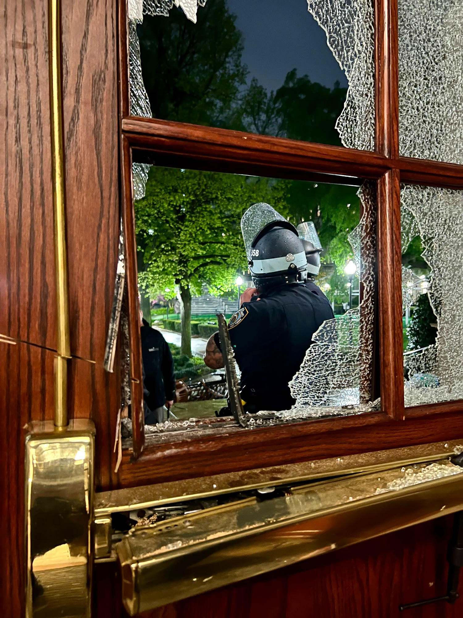 Smashed windows and piled furniture left after occupation of Hamilton Hall