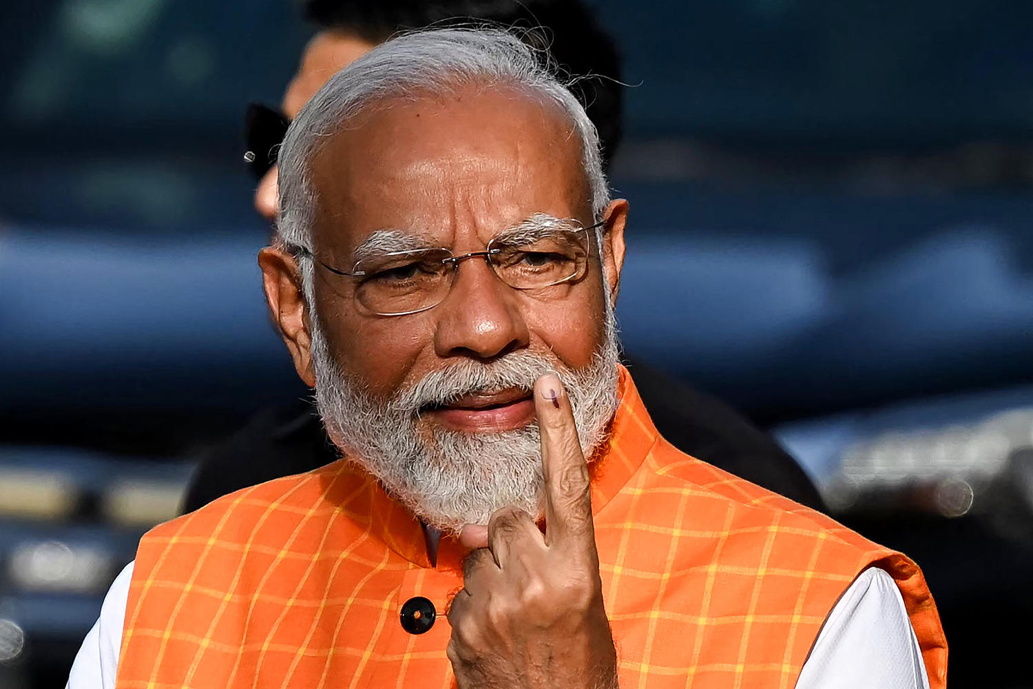 India's Prime Minister Narendra Modi casts his vote as giant election reaches half-way mark