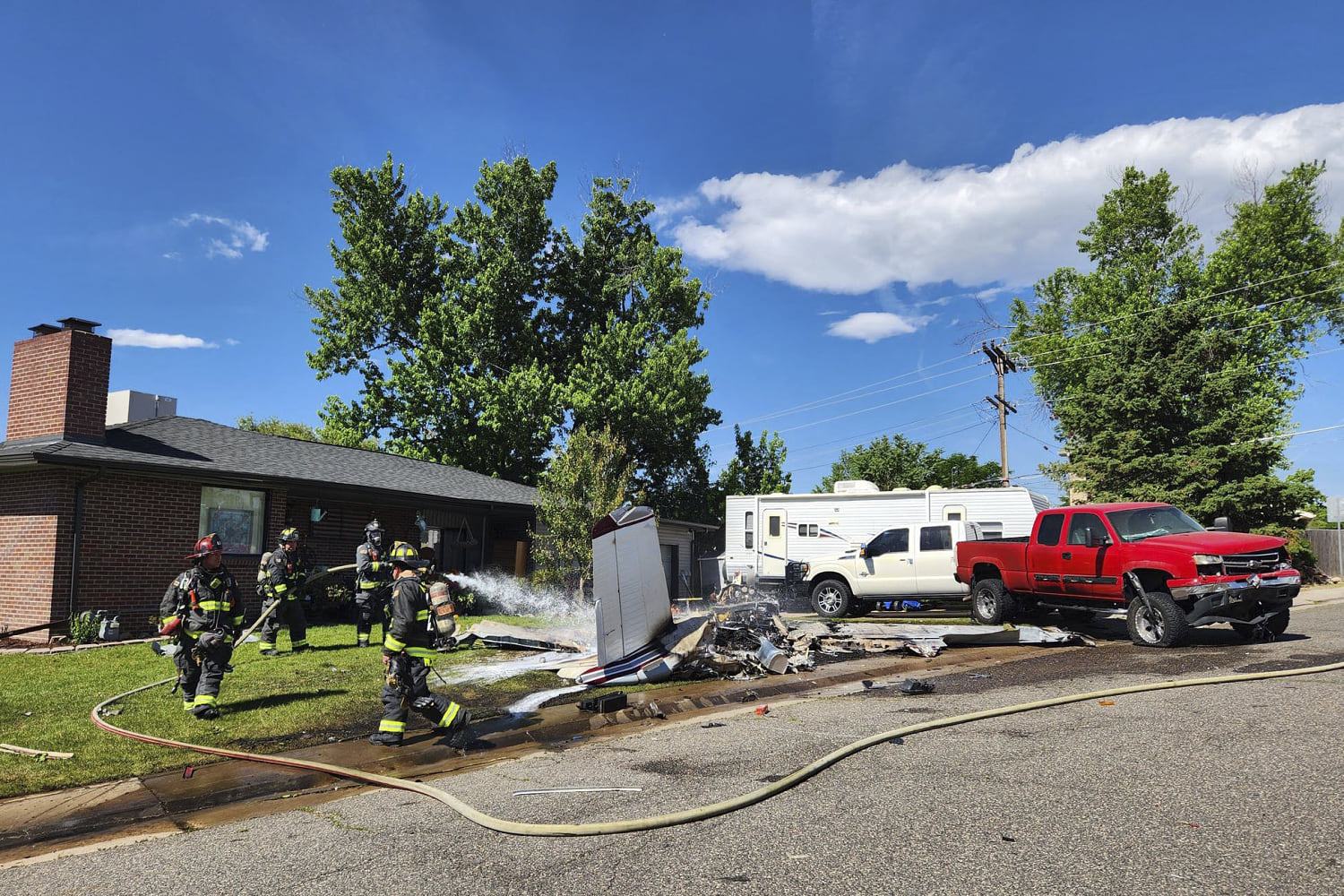 Small airplane crashes in front of Colorado home injuring 4, authorities say