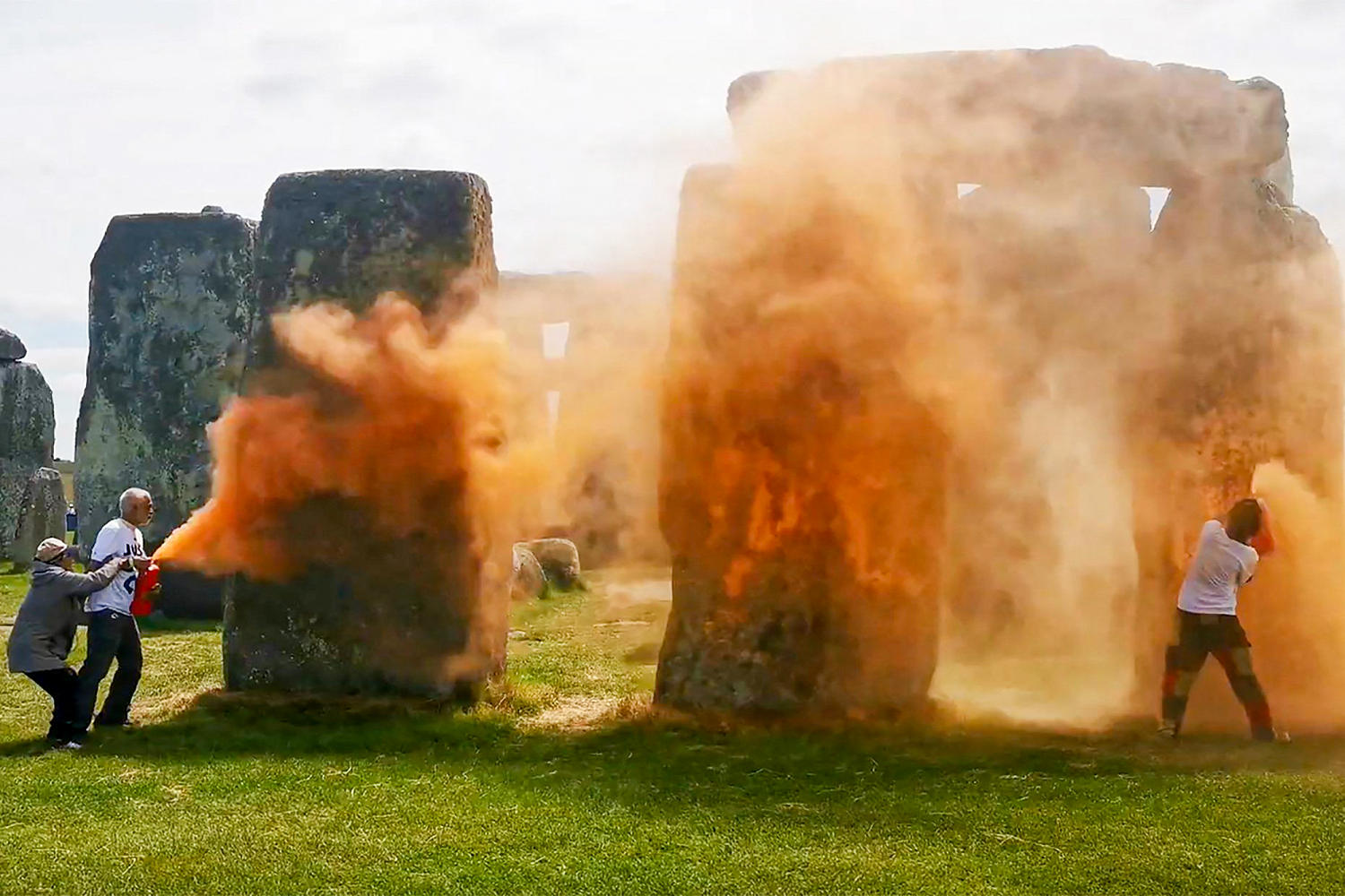 Why climate protesters painted Stonehenge with orange corn flour