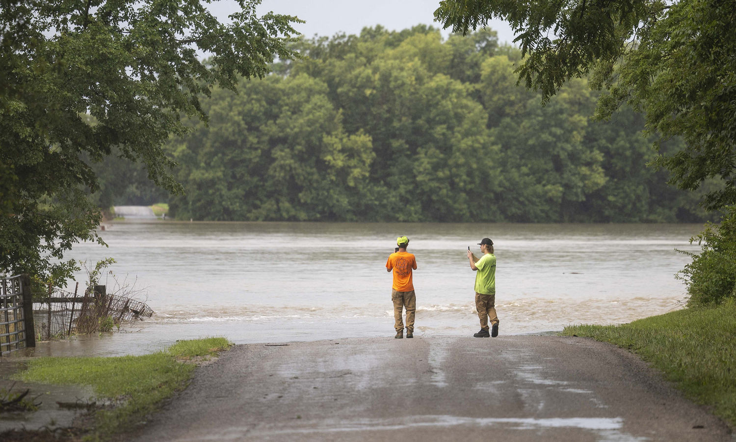 A dam fails after rain, wind and tornadoes pound the Midwest