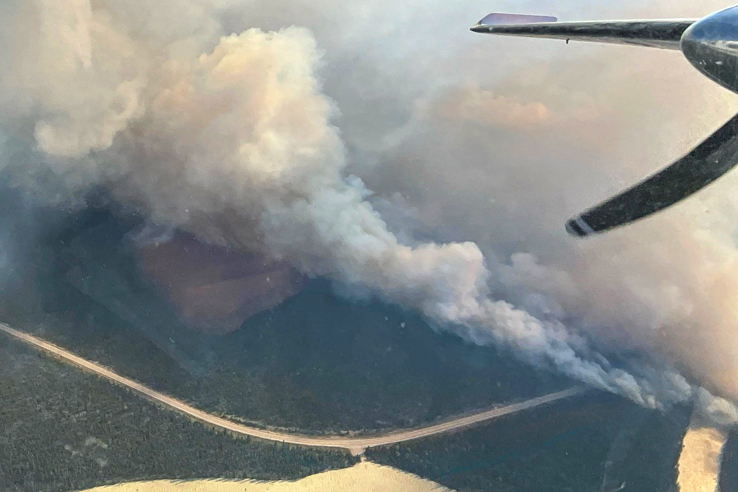 Wildfires blaze across western U.S. and Canada, prompting thousands to evacuate and poor air quality