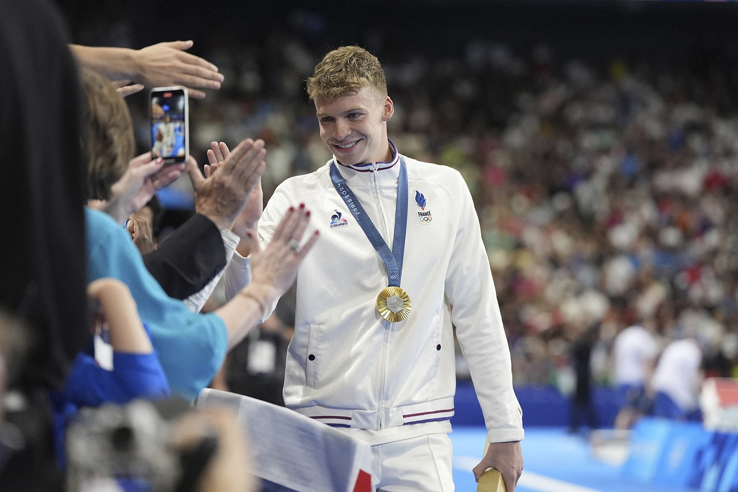Léon Marchand wins Olympic gold in 400 IM and the admiration of France