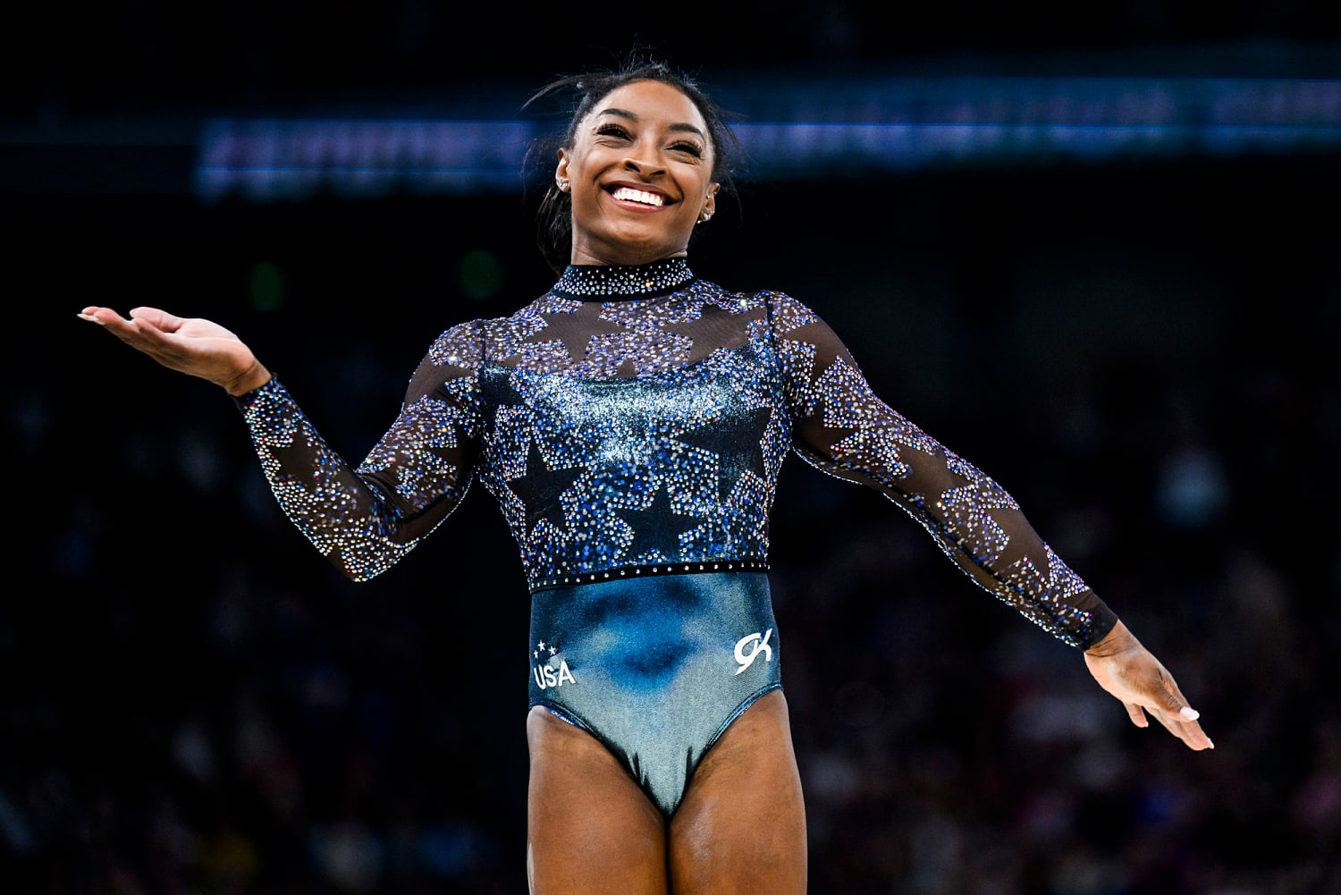 Simone Biles pushes through calf pain to qualify for five finals, U.S. women's team sits in first