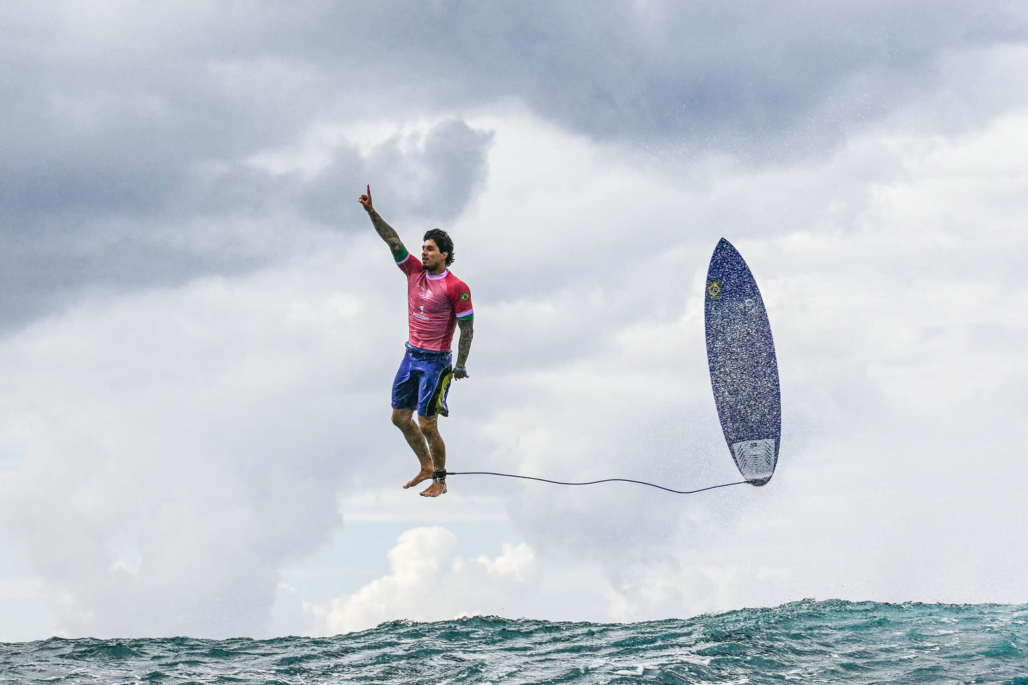 Brazilian surfer's historic ride at the Olympics spawns iconic photo