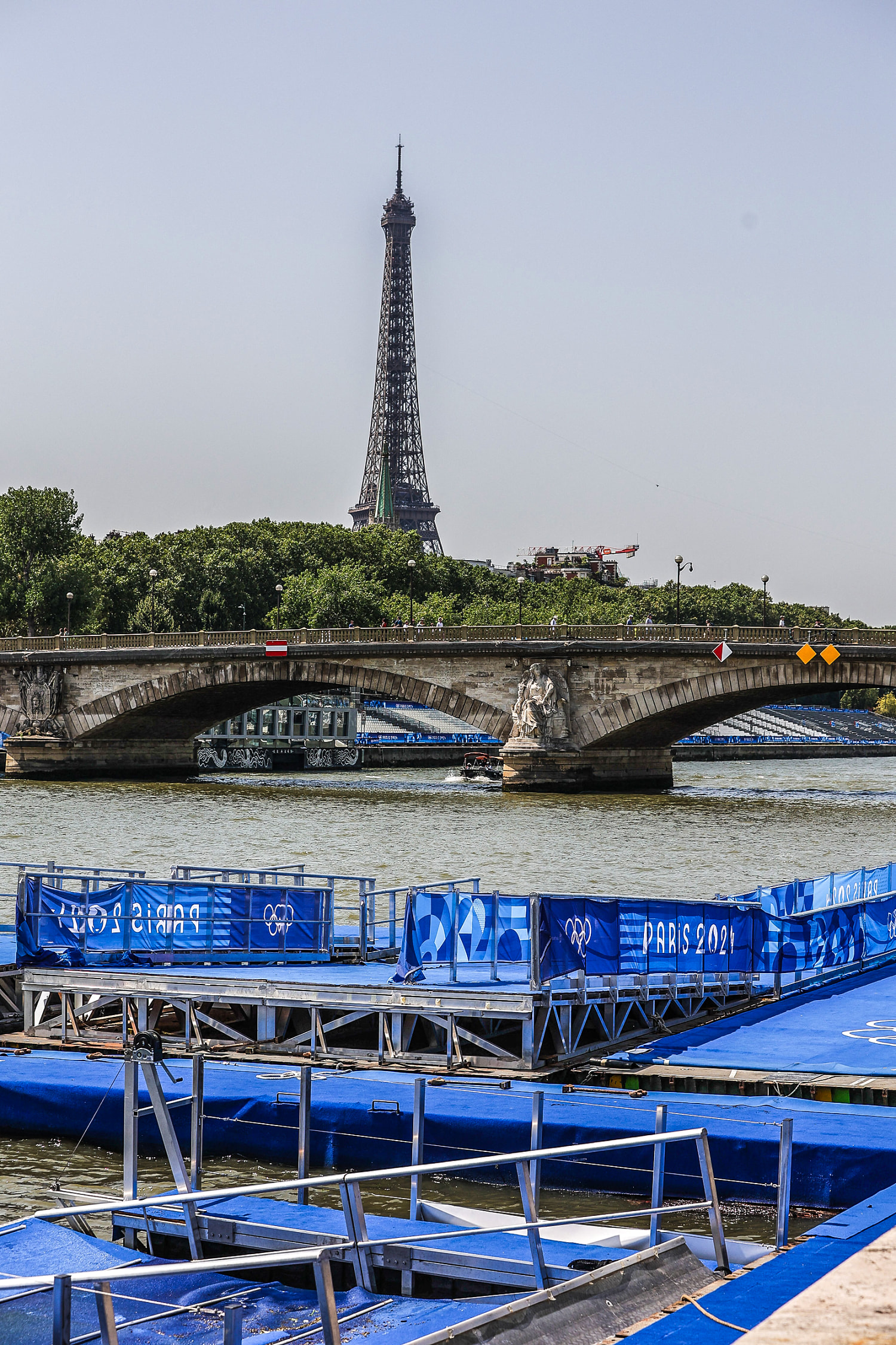 Triathletes swim in Seine after last-minute testing deems water safe