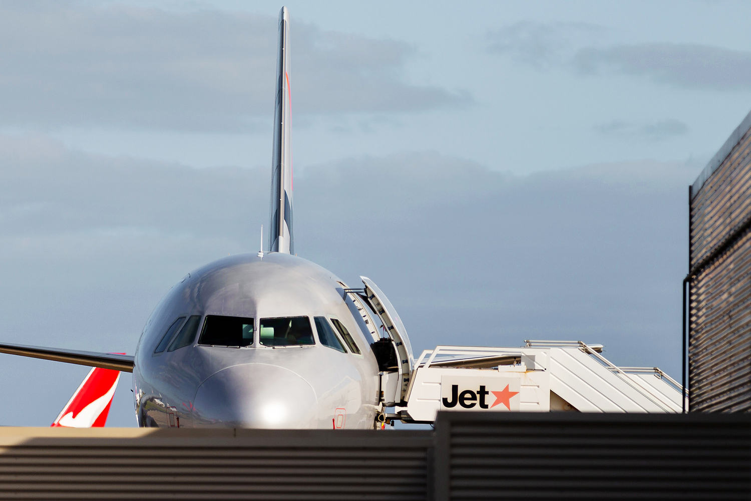 Man arrested at airport after opening plane door and walking on wing