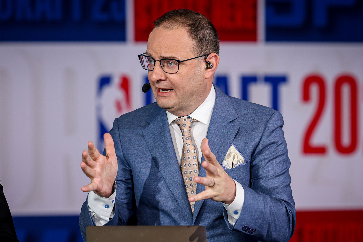 ESPN’s Adrian Wojnarowski will retire from the company to take a job in college basketball