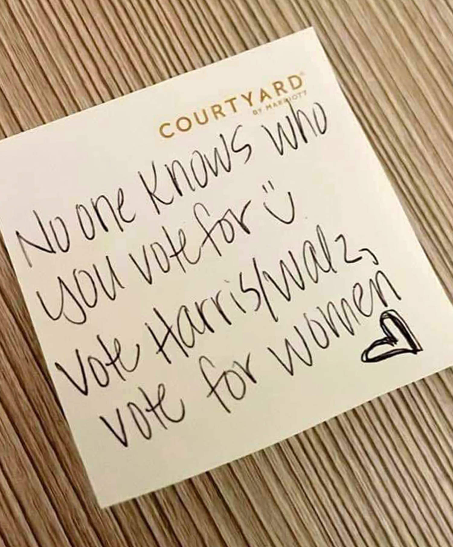 Pro-Harris sticky notes pop up in women's restrooms and gyms and on tampon boxes