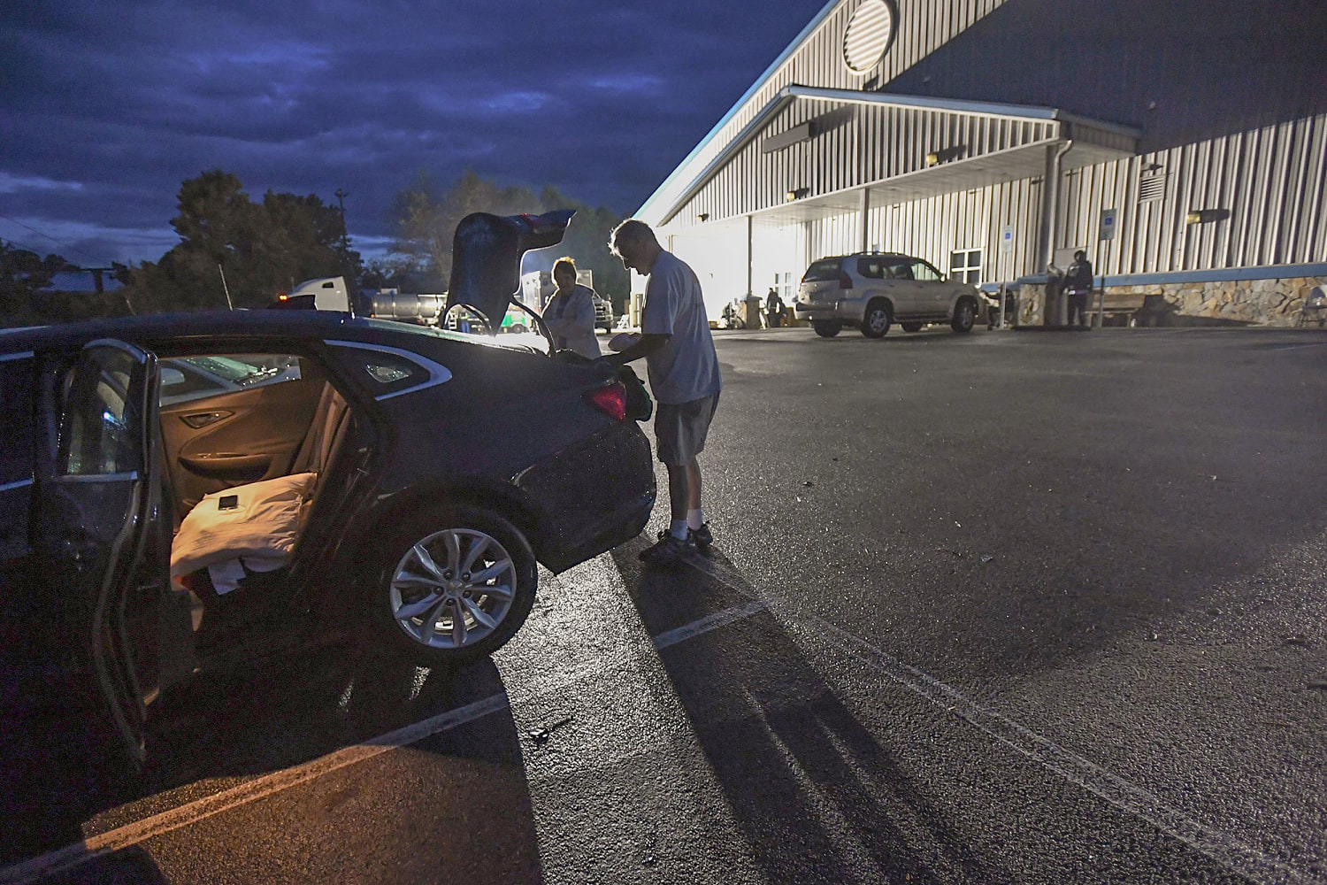 Storm survivors at a packed shelter in Asheville are still in shock