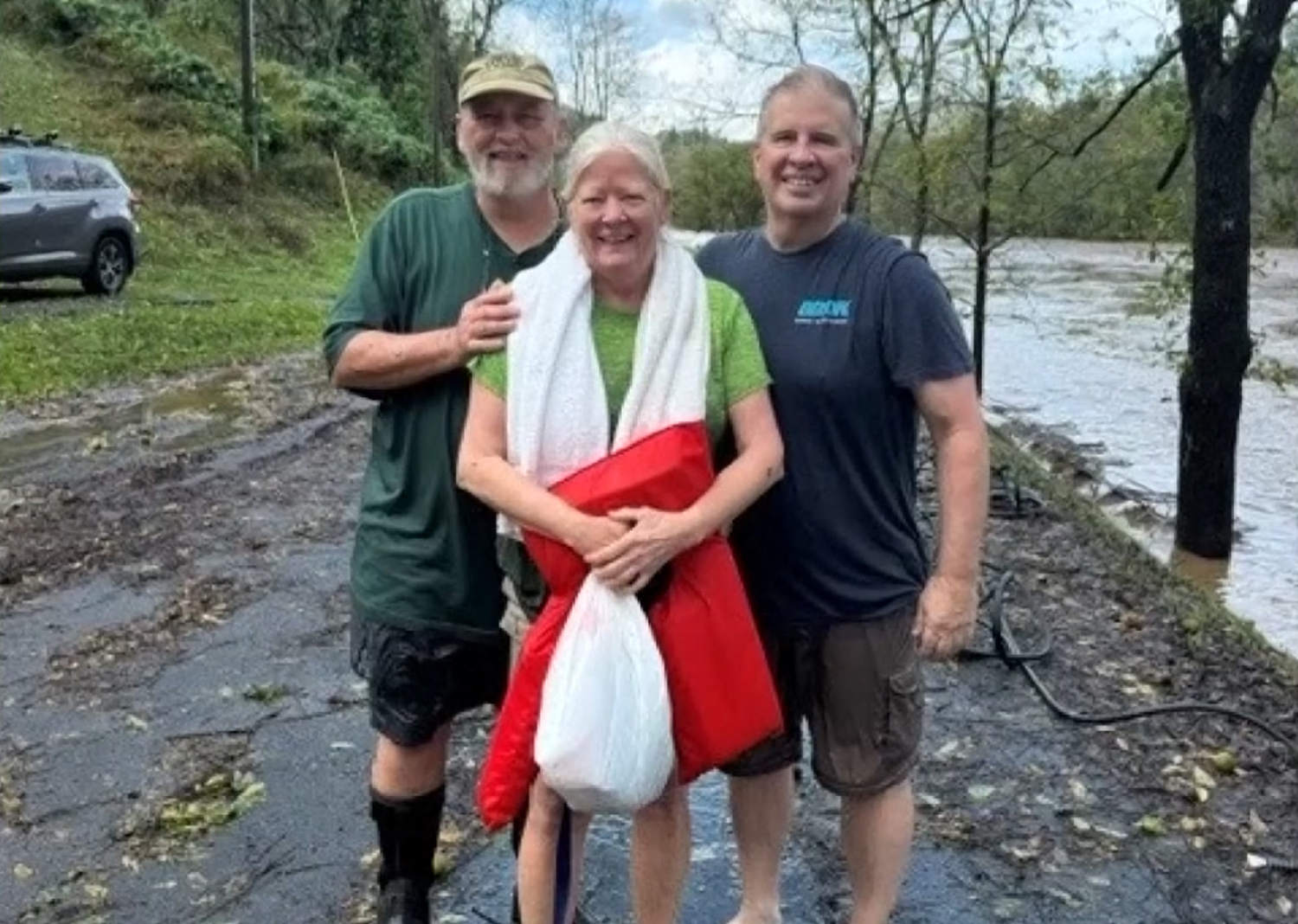 North Carolina man jumps into fast-moving flood waters to save trapped woman