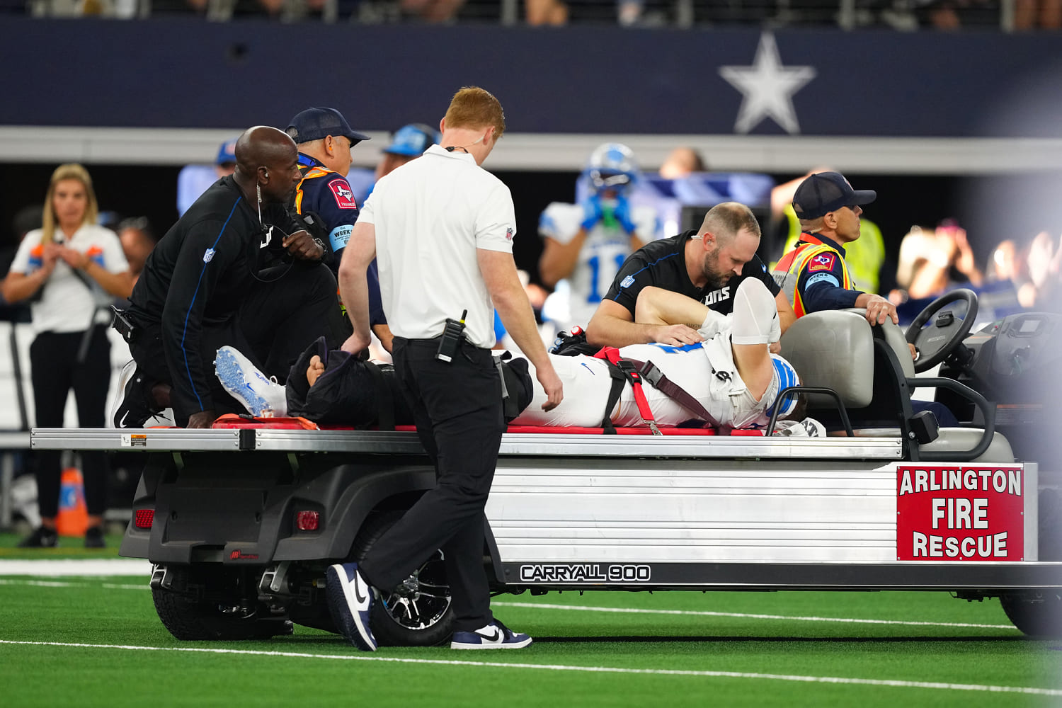 NFL sack leader, Lions defensive end Aidan Hutchinson carted off with leg injury