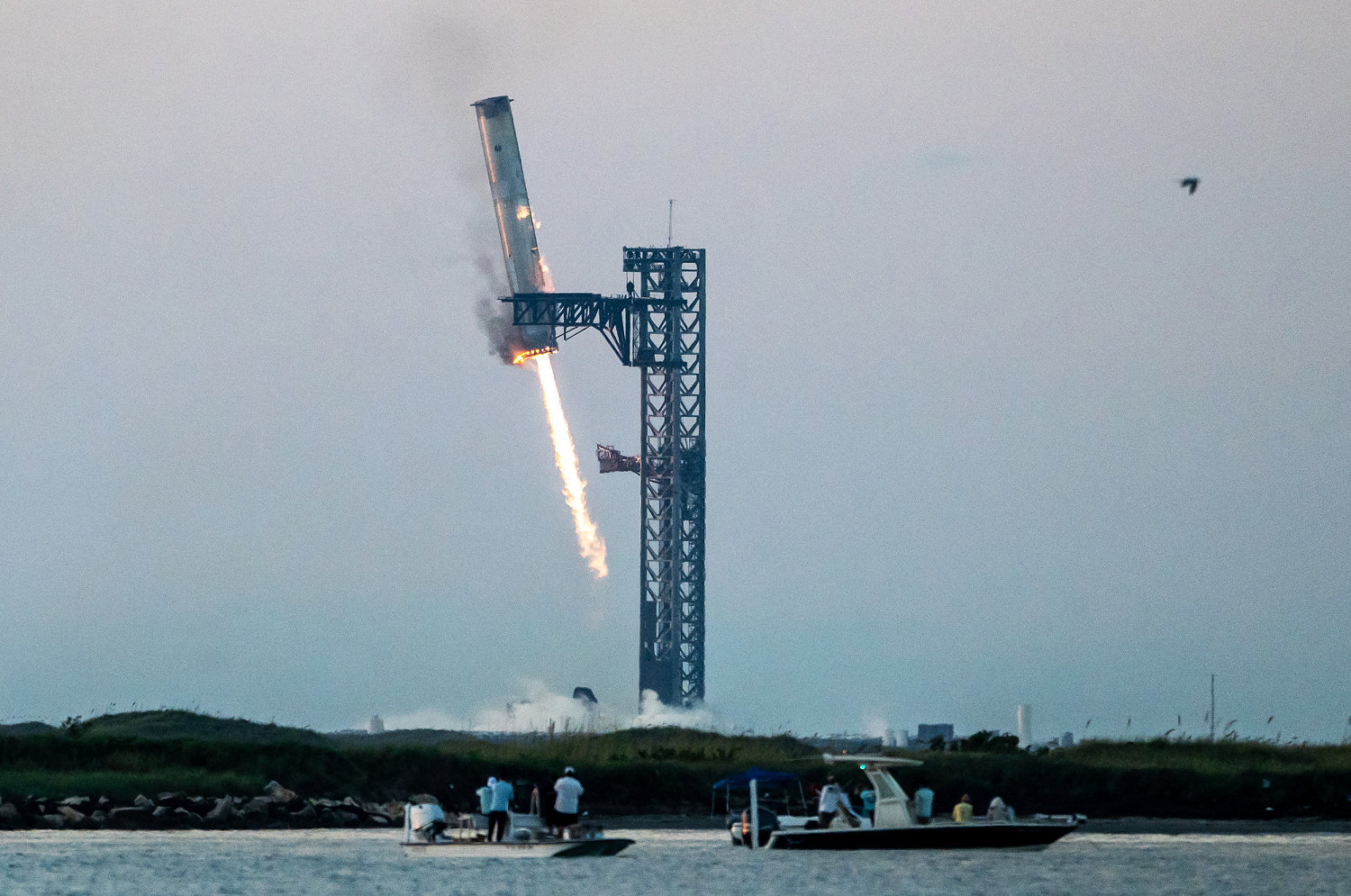 SpaceX catches Starship rocket booster in dramatic landing during fifth flight test