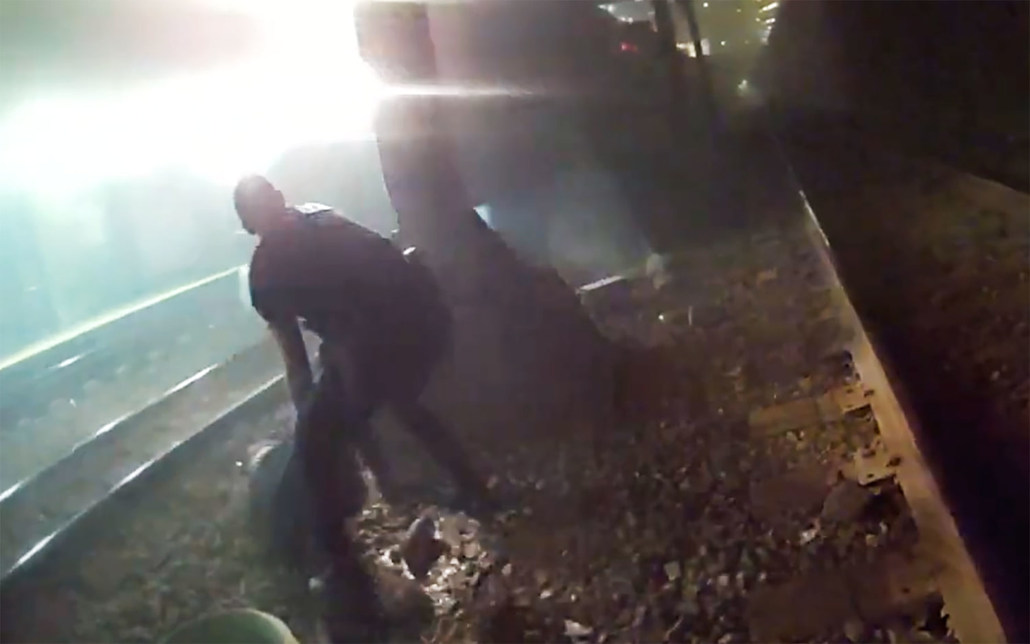 Police rescue injured man from tracks seconds before an oncoming train