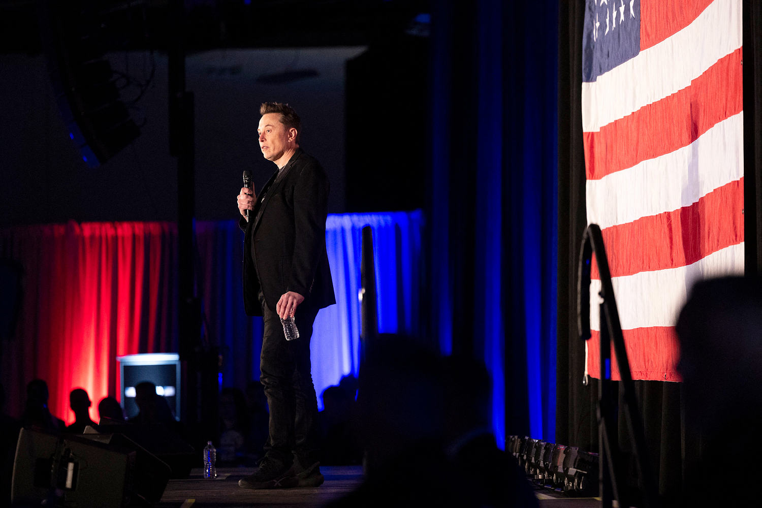 Elon Musk says all voting should be ‘in person’ while his super PAC promotes voting by mail