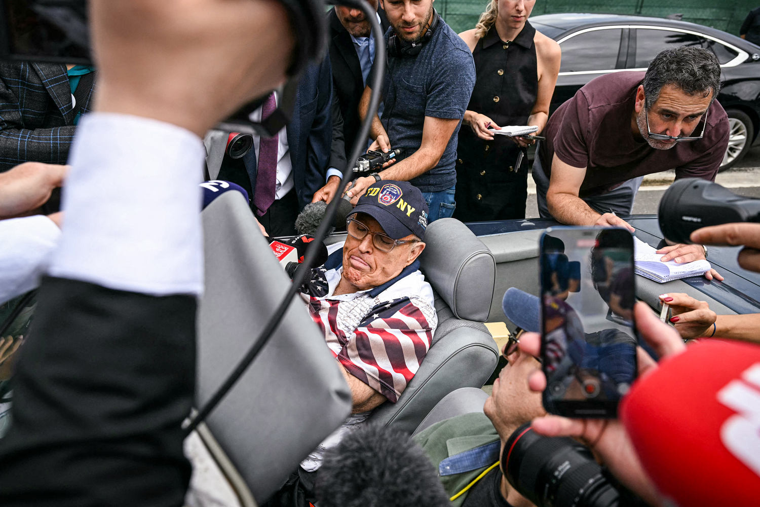 Rudy Giuliani shows up to vote in the Mercedes he was ordered to surrender