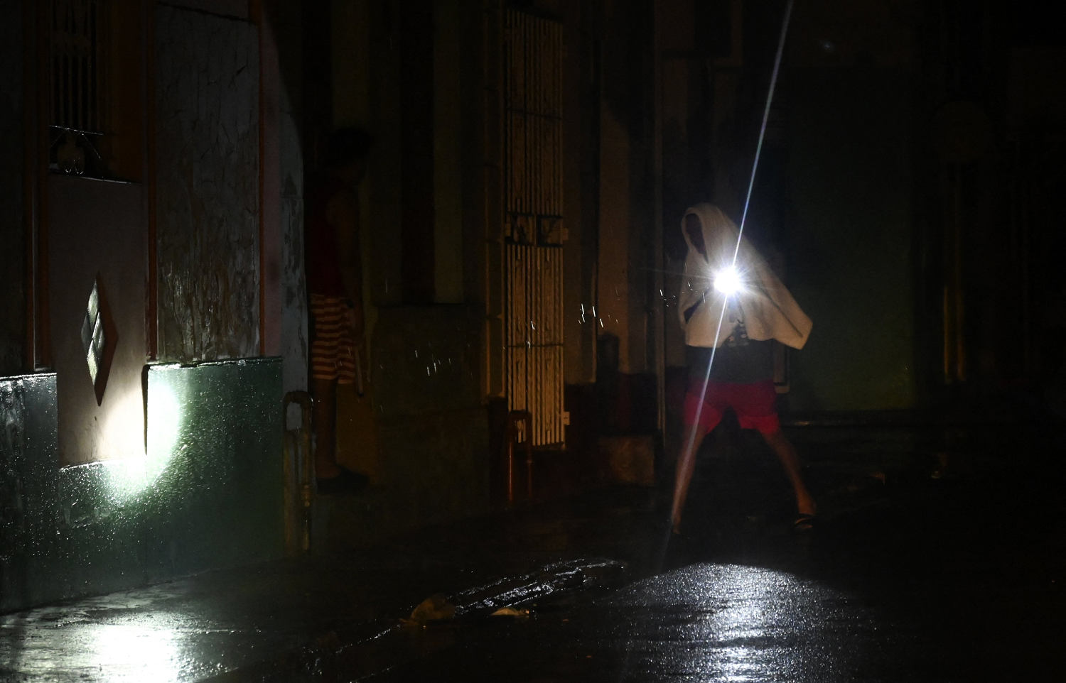 Hurricane Rafael turns west after battering Cuba and knocking out power grid