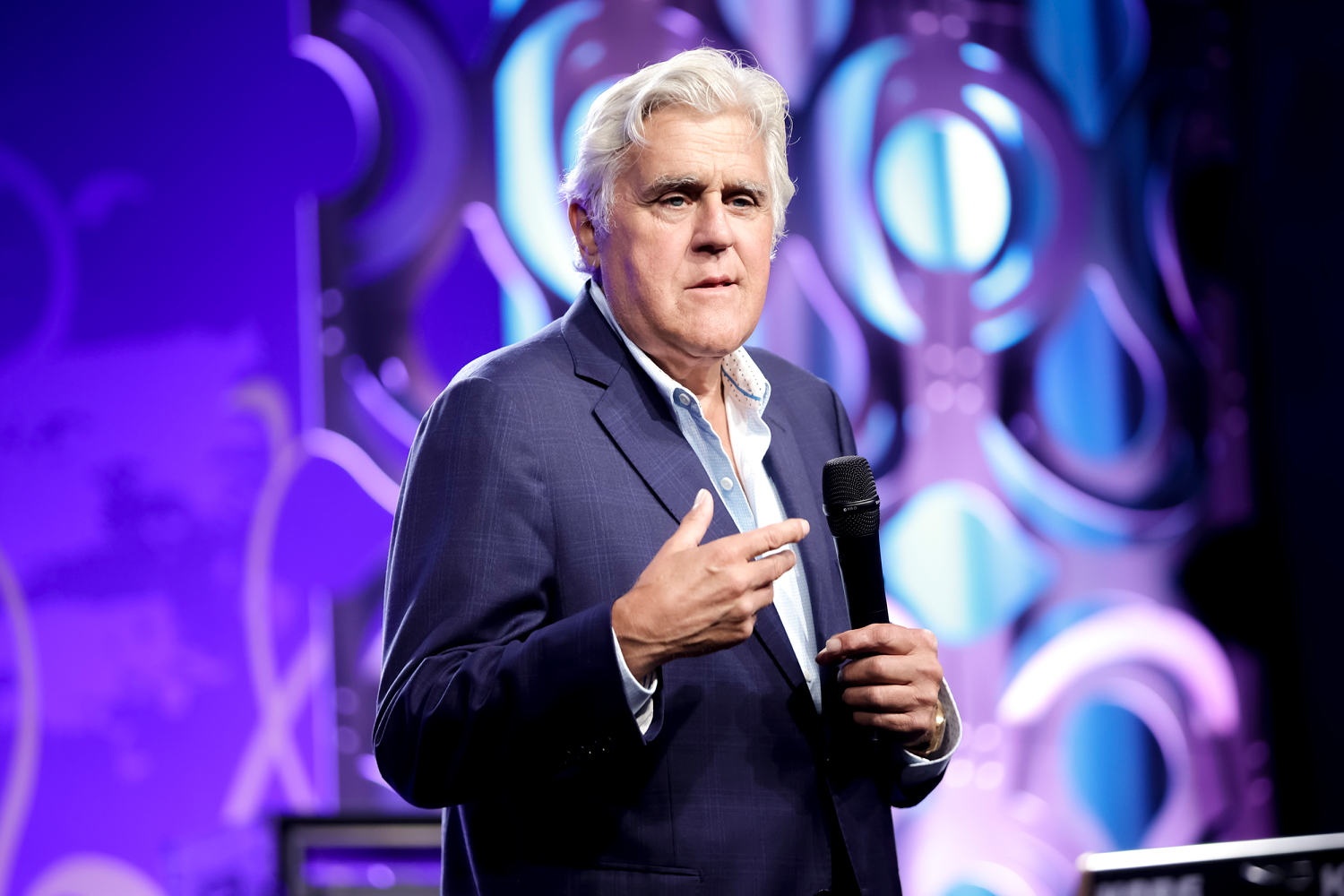 Jay Leno shows up with bruised face and an eye patch to comedy show after fall