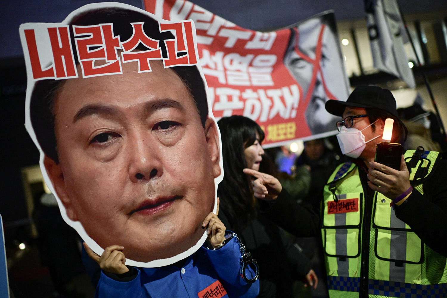 South Korea imposes travel ban on president over martial law declaration