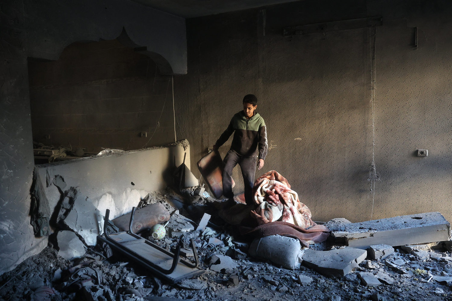 Father and infant son buried together after an Israeli strike that killed dozens in Gaza