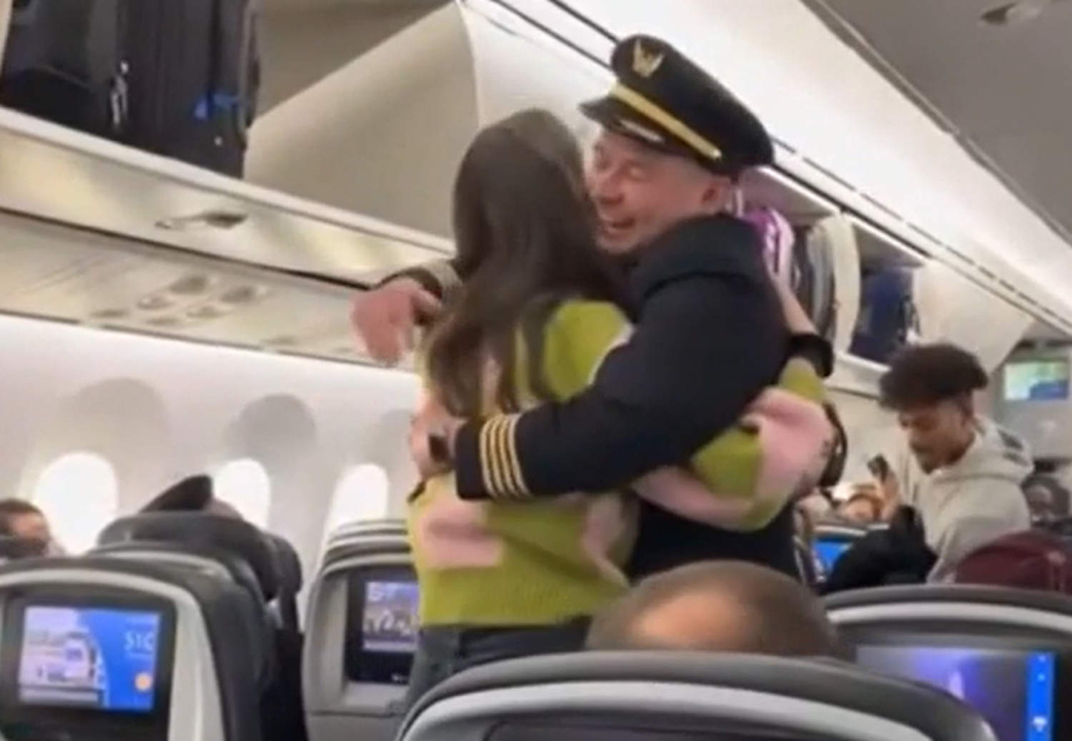 United pilot embraces his bone marrow donor after learning she was a passenger on his flight