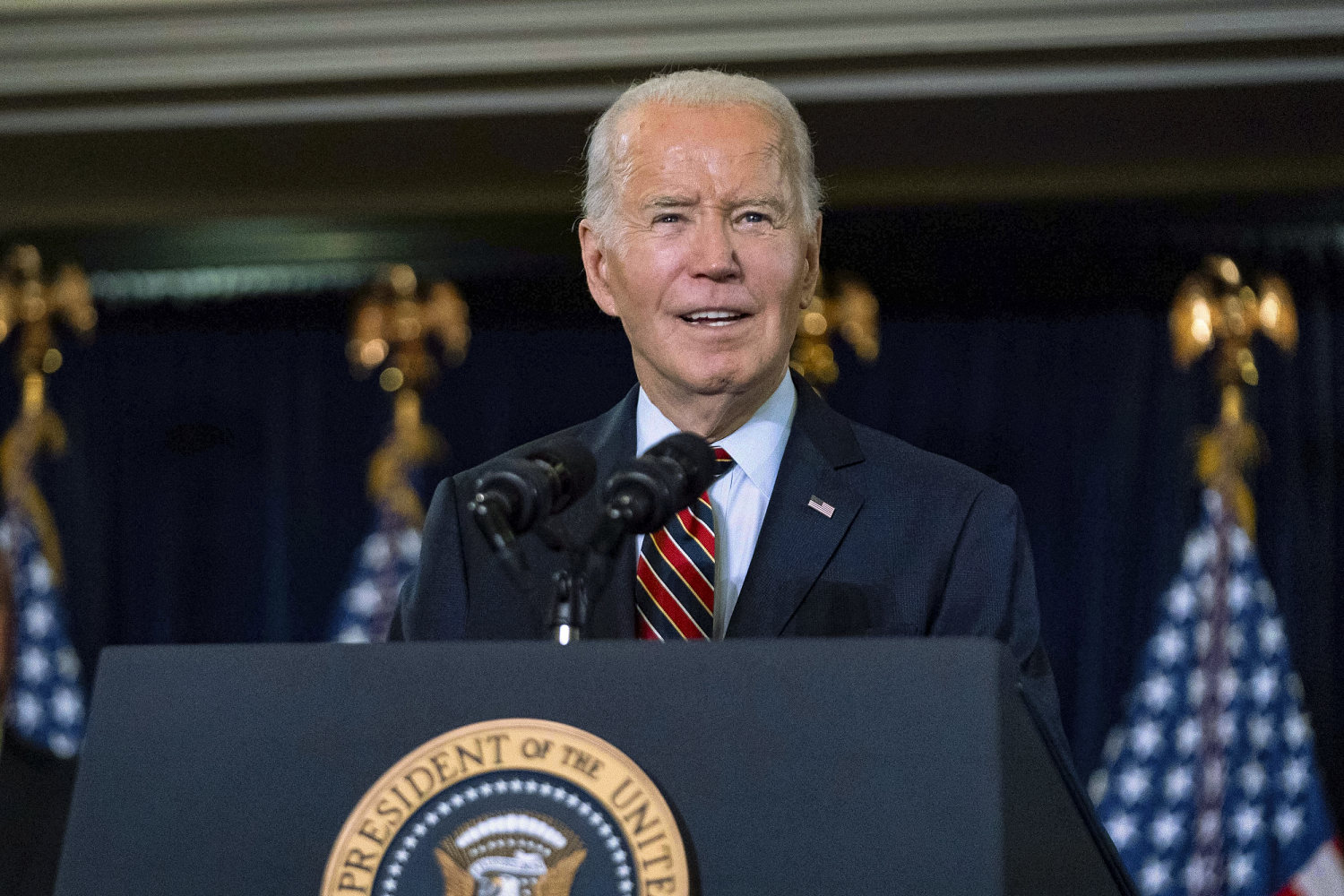 Biden signs defense bill despite objections to ban on transgender health care for military children