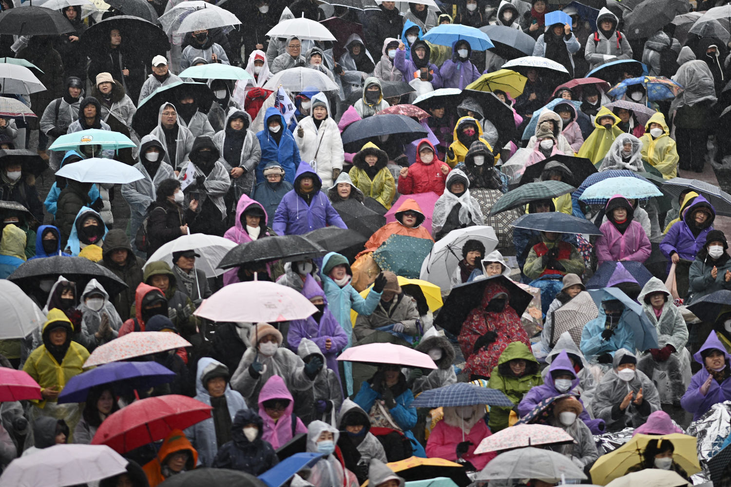 South Korean protesters brave cold and snow to demand Yoon’s ouster as detention deadline looms