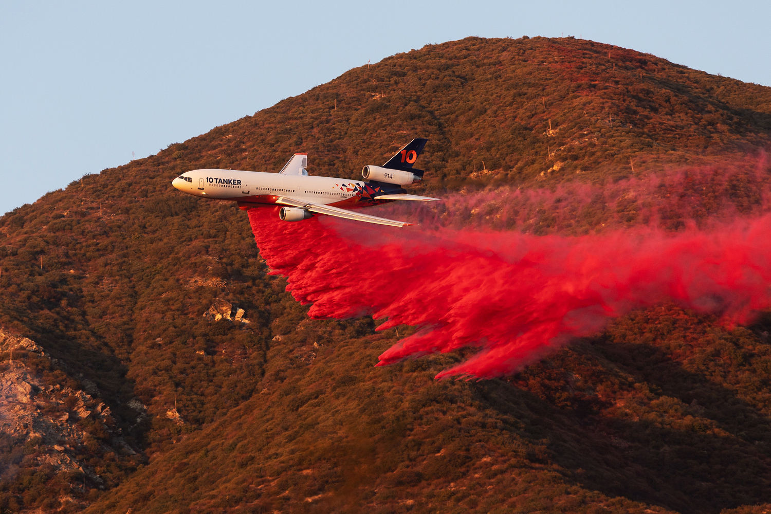 What is the pink powder sprayed over the California wildfires?