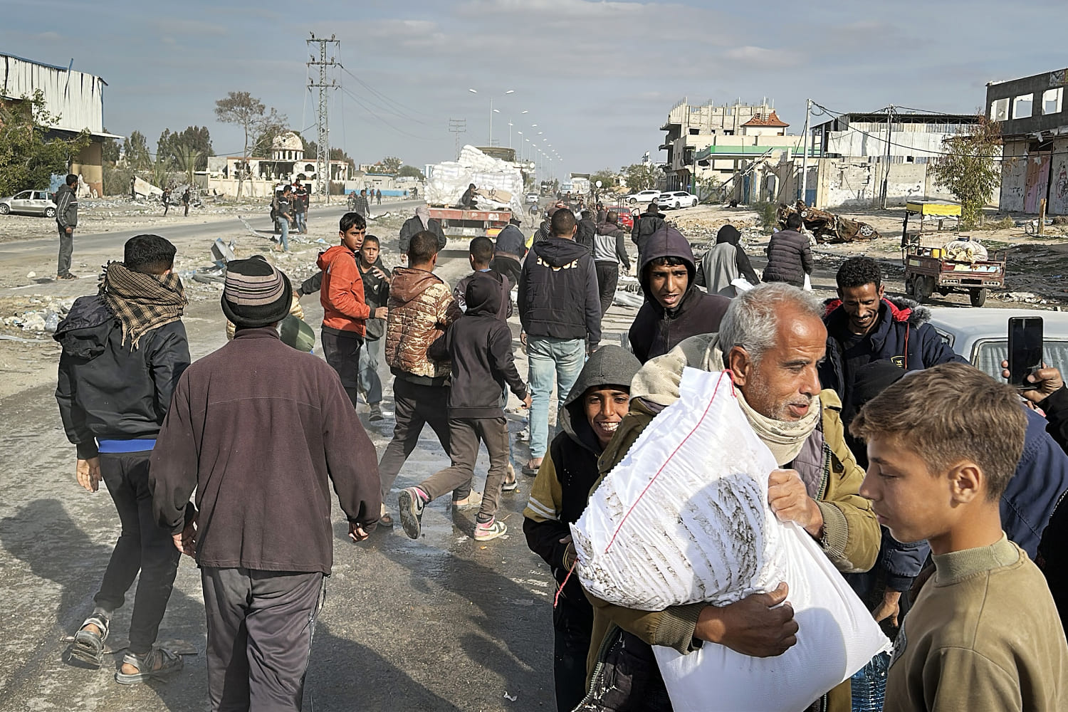 Aid convoys snake their way through ruins in Gaza as attention shifts to rebuilding