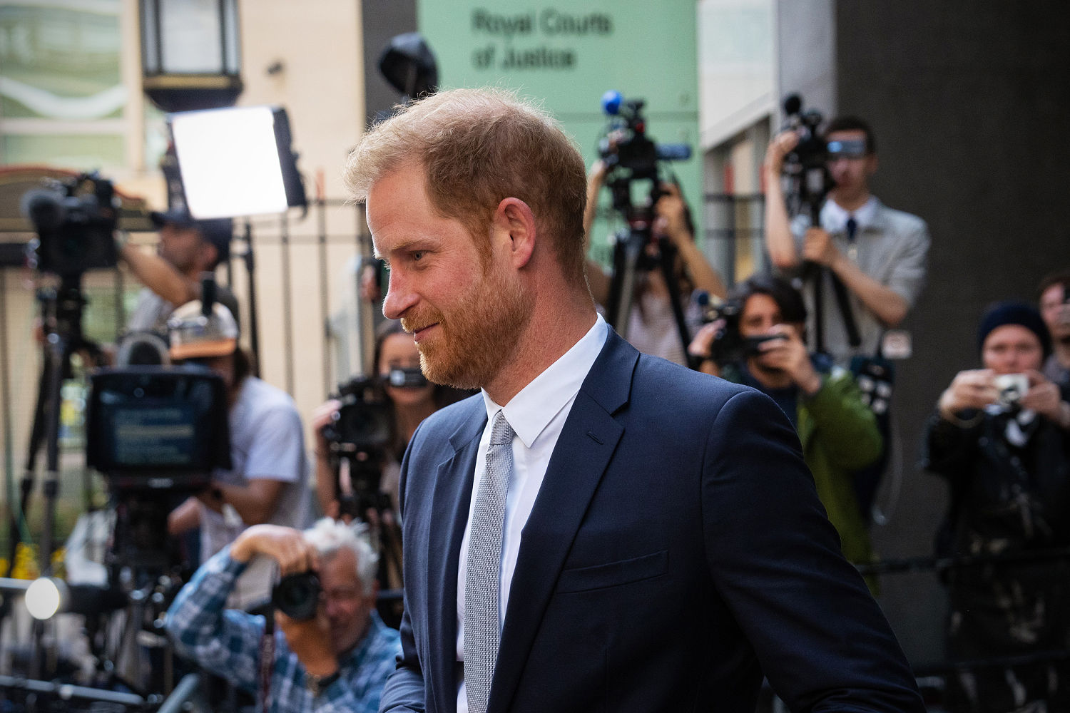 Prince Harry settles lawsuit with Murdoch papers after apology