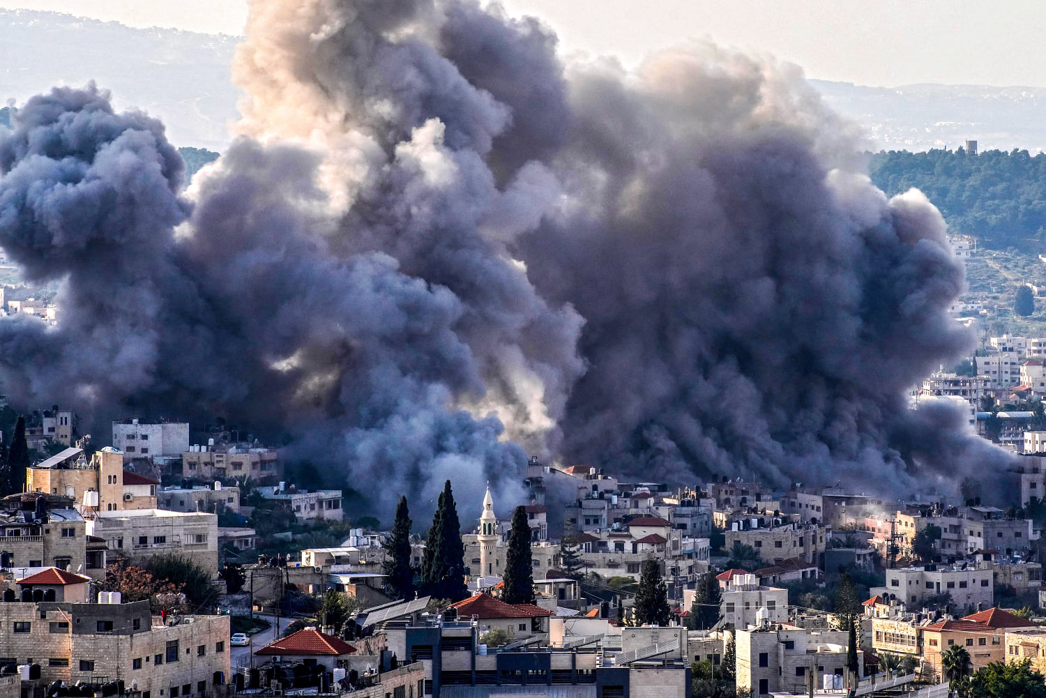 Simultaneous explosions by Israeli military destroys buildings in the West Bank