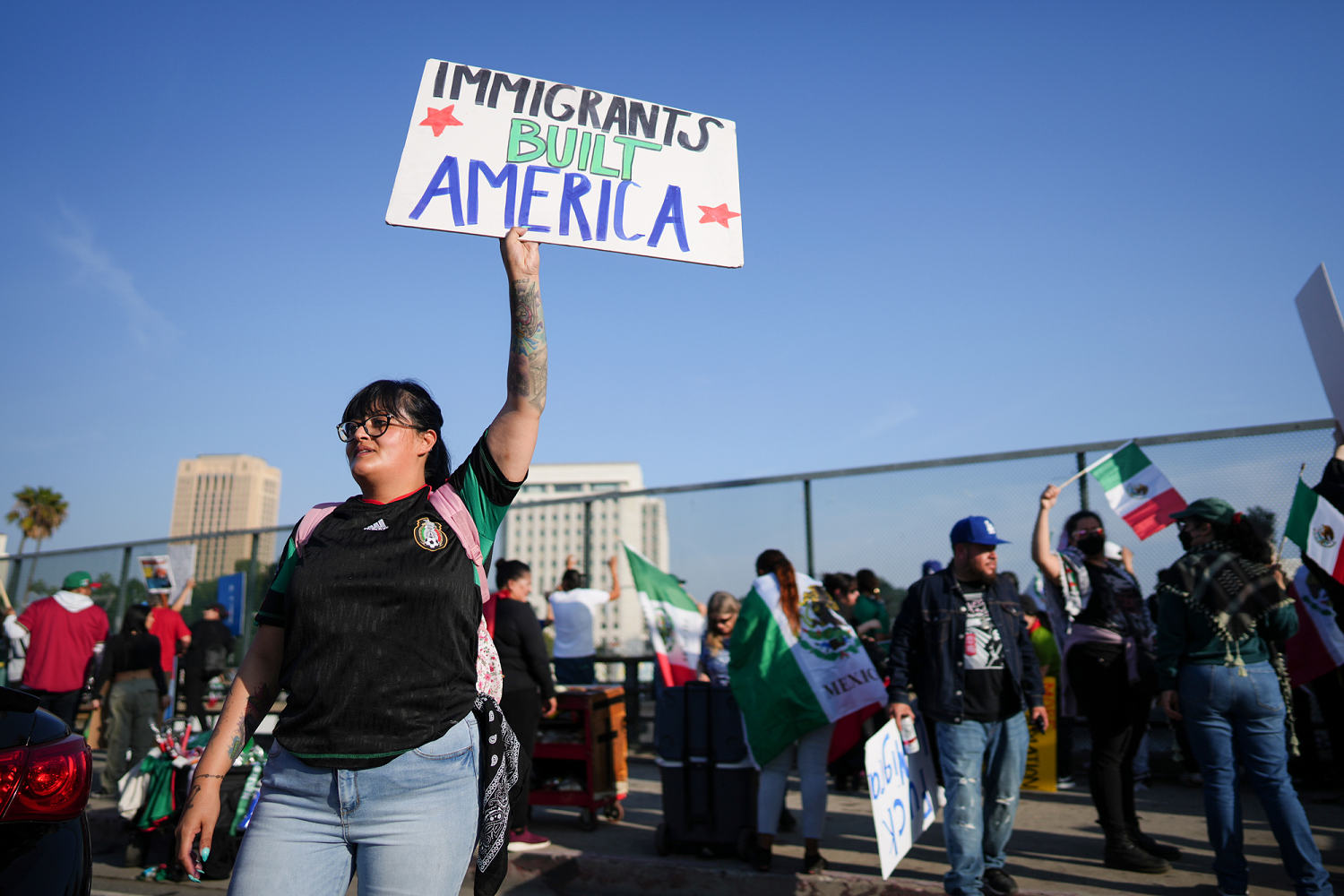 Marchers protesting planned deportations block major freeway in Los Angeles