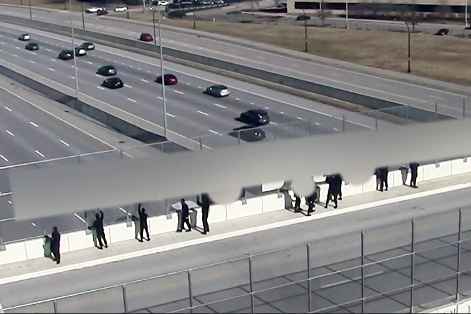 Demonstrators with Nazi flags leave Cincinnati-area highway overpass after residents confront them