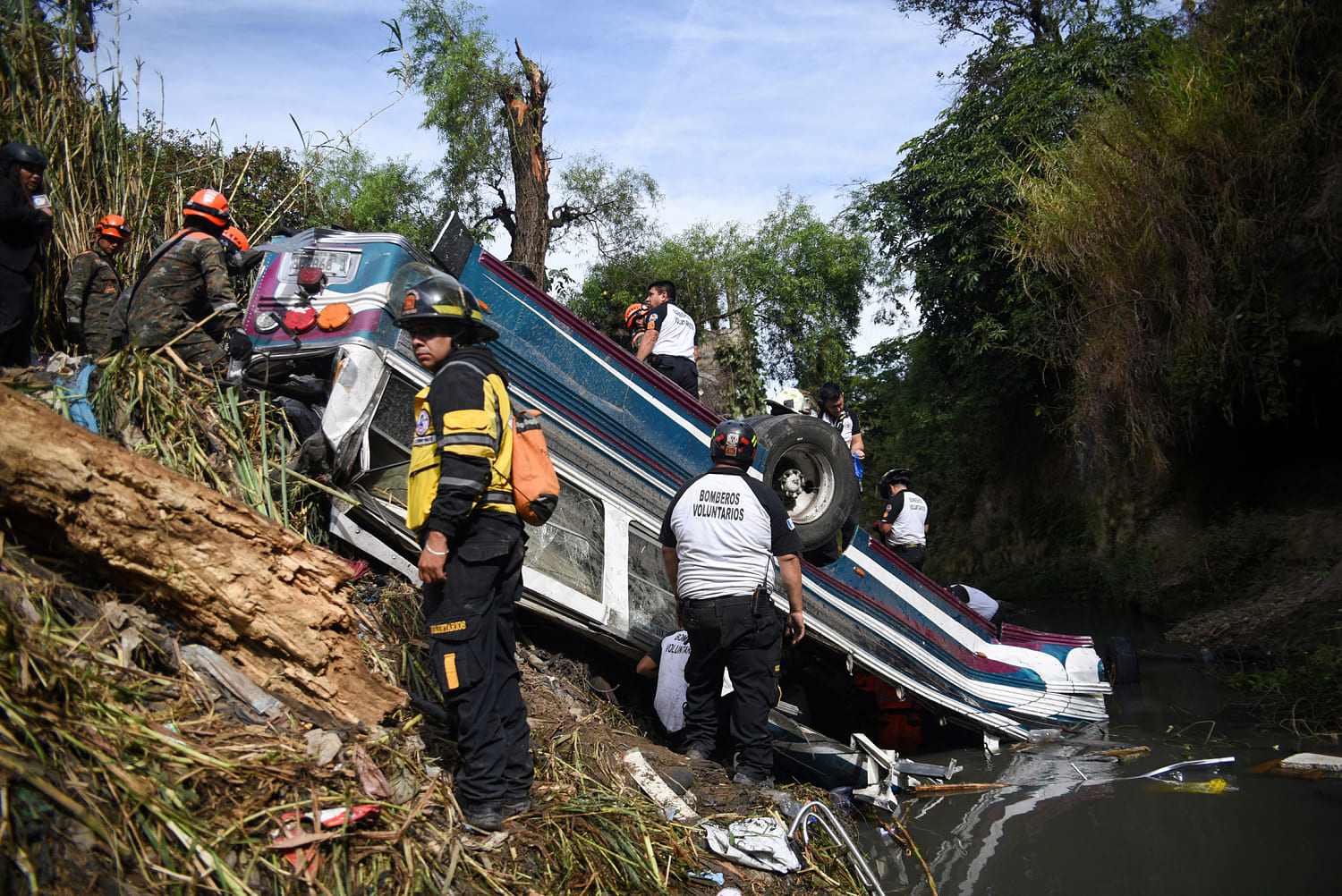 At least 50 die in Guatemala after bus plunges off bridge