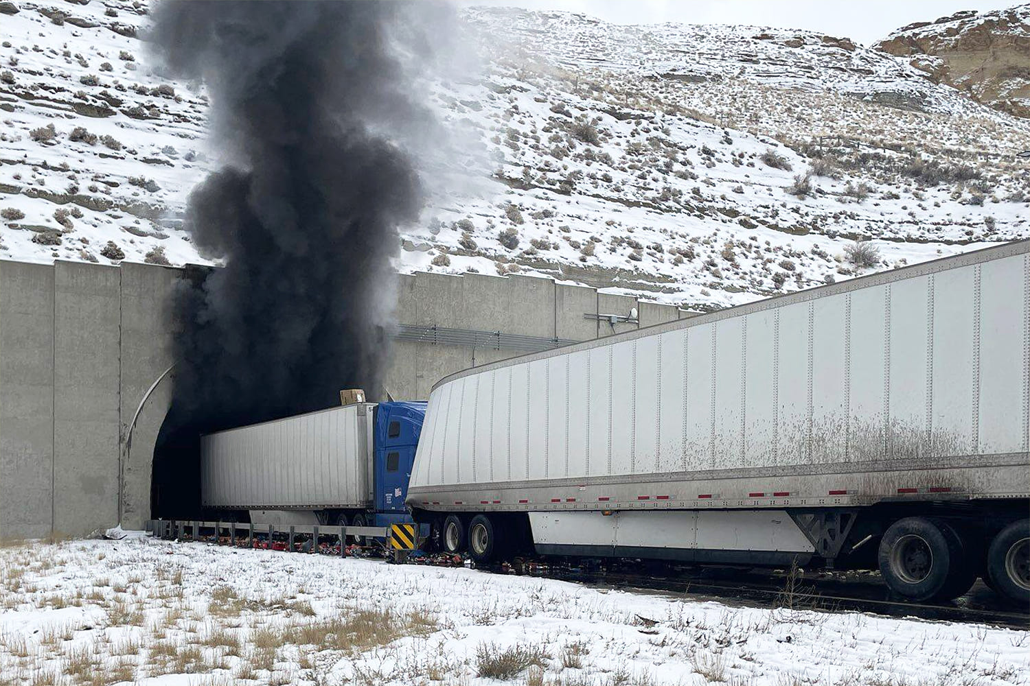 NTSB investigating Wyoming highway tunnel pileup that killed 2 and closed major interstate