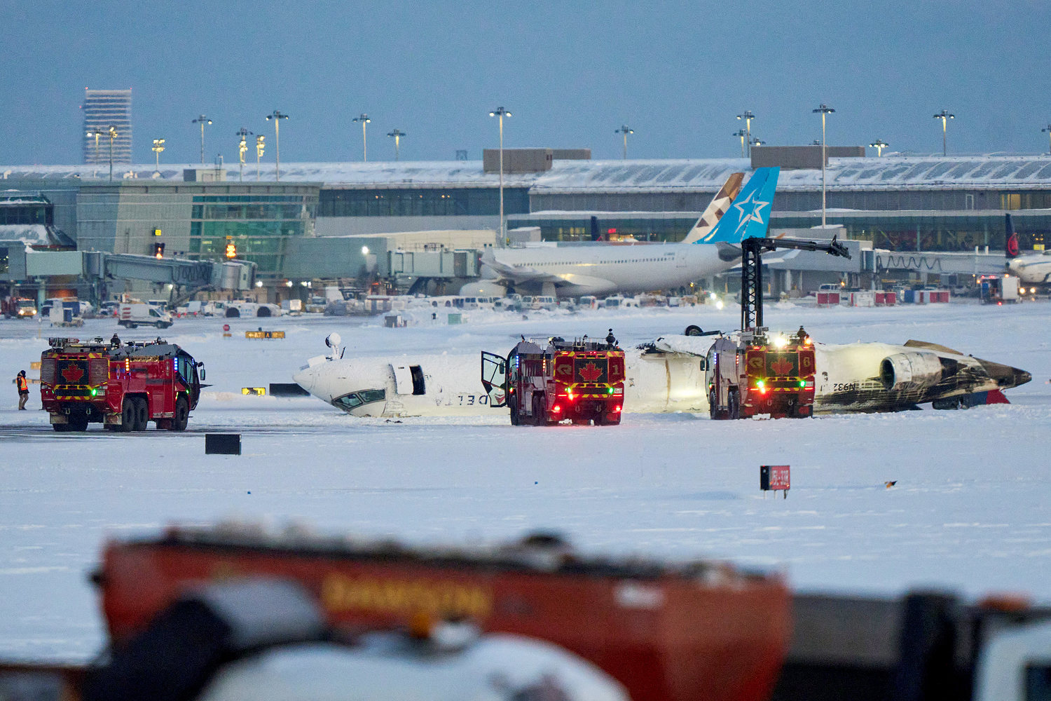 Delta plane flipped on Toronto runway during 'clear day' after extreme snowfall, official says